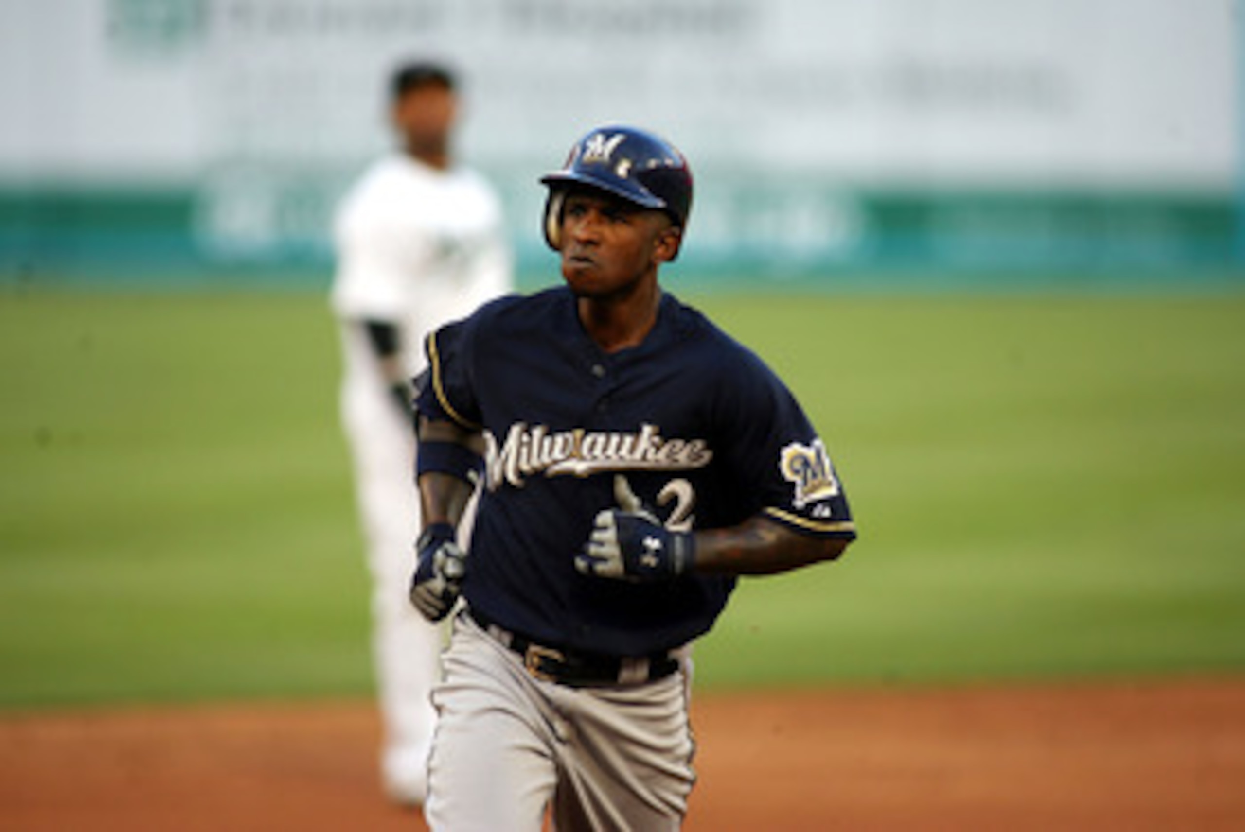 MIAMI GARDENS, FL - JUNE 04:  Nyjer Morgan #2 of the Milwaukee Brewers hits a home run against the Florida Marlins at Sun Life Stadium on June 4, 2011 in Miami Gardens, Florida.  (Photo by Marc Serota/Getty Images)