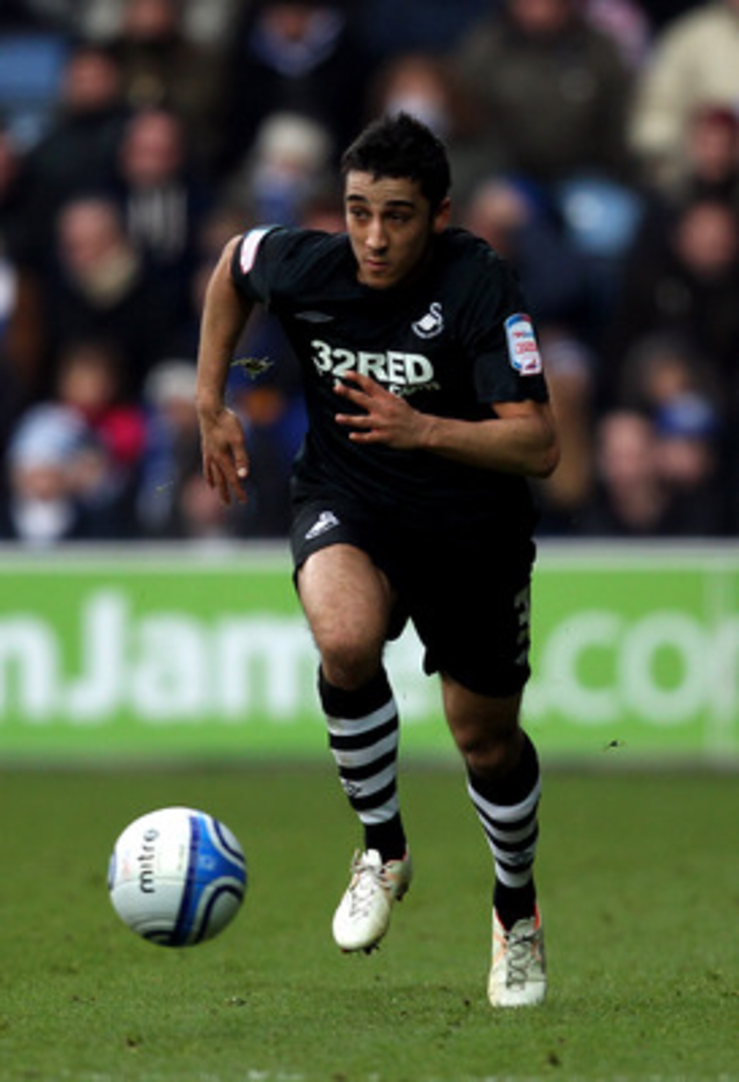 LONDON, ENGLAND - DECEMBER 26:  Neil Taylor of Swansea City in action during the npower Championship match between Queens Park Rangers and Swansea City at Loftus Road on December 26, 2010 in London, England.  (Photo by Warren Little/Getty Images)