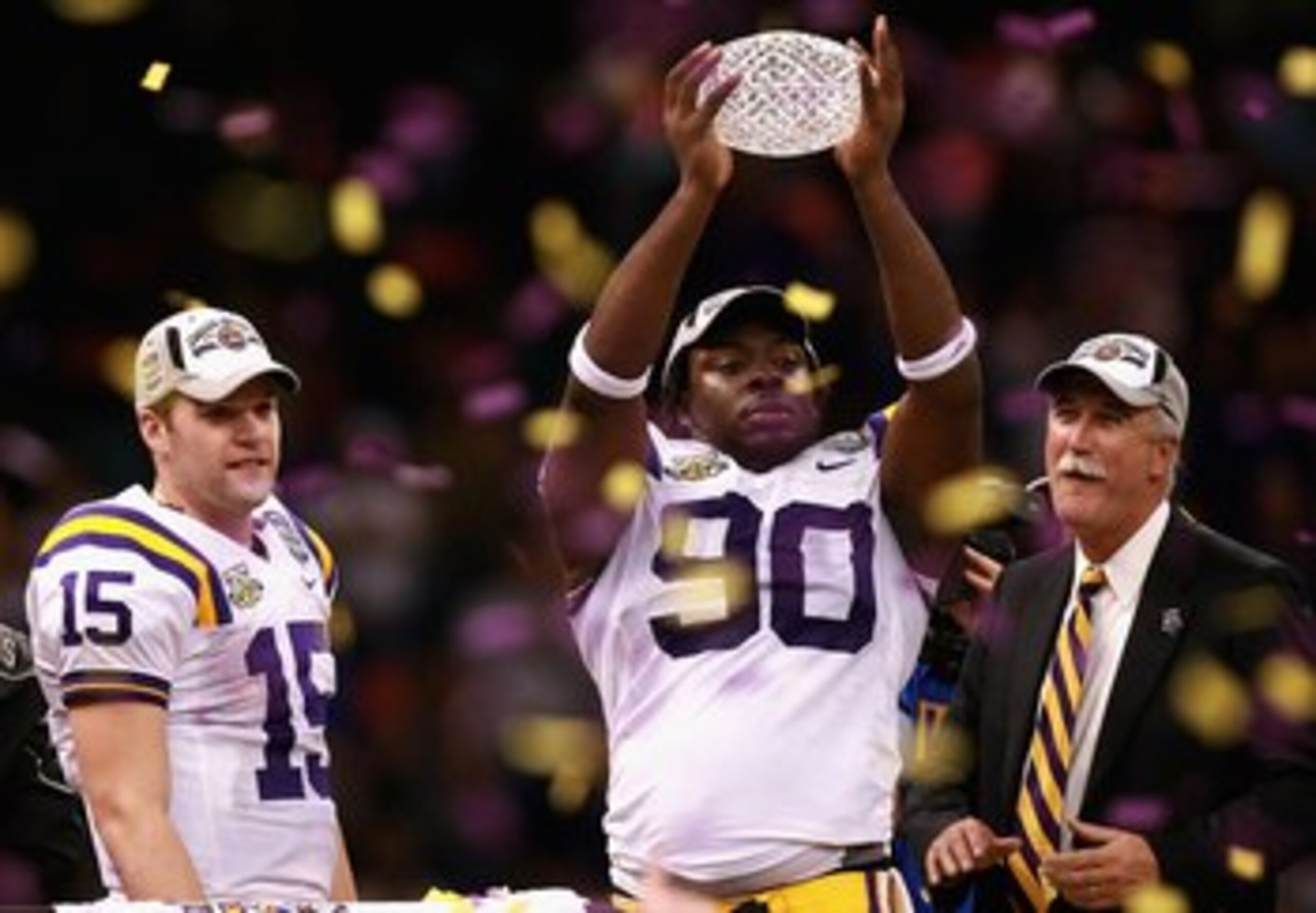 NEW ORLEANS - JANUARY 07:  Ricky Jean-Francois #90 of the Louisiana State University Tigers celebrates with the championship trophy after defeating the Ohio State Buckeyes 38-24 in the AllState BCS National Championship on January 7, 2008 at the Louisiana