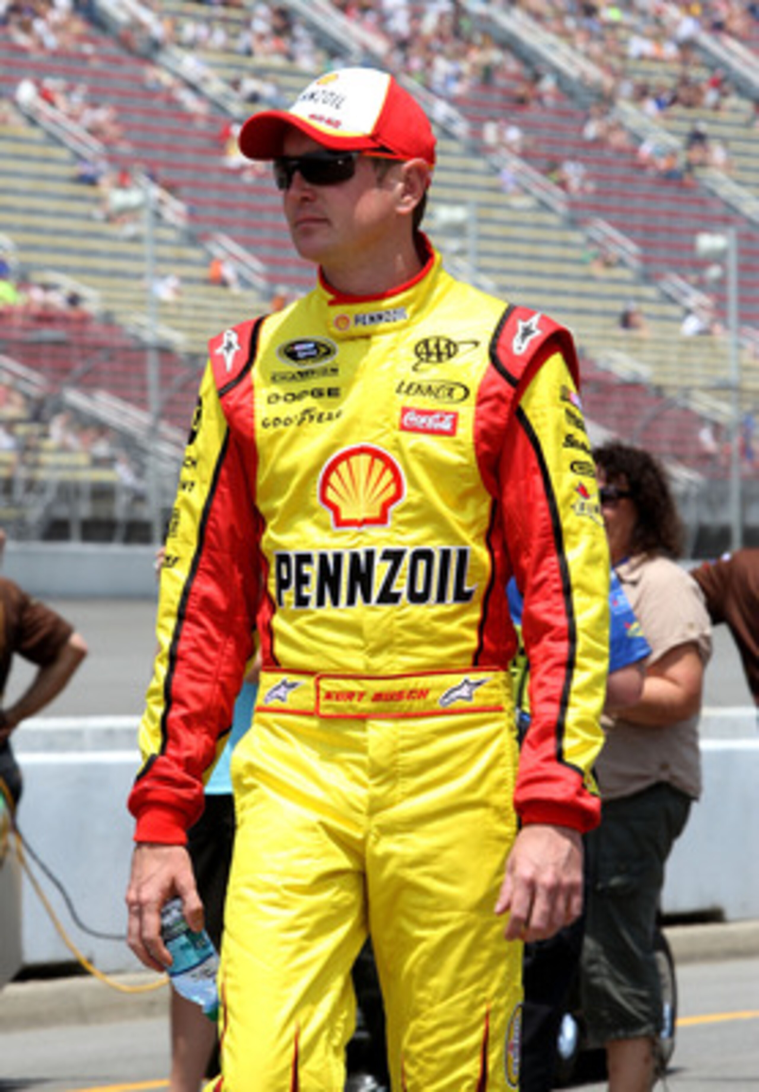 BROOKLYN, MI - JUNE 18:  Kurt Busch, driver of the #22 Shell/Pennzoil Dodge, walks on pit road during qualifying for the NASCAR Sprint Cup Series Heluva Good! Sour Cream Dips 400 at Michigan International Speedway on June 18, 2011 in Brooklyn, Michigan.