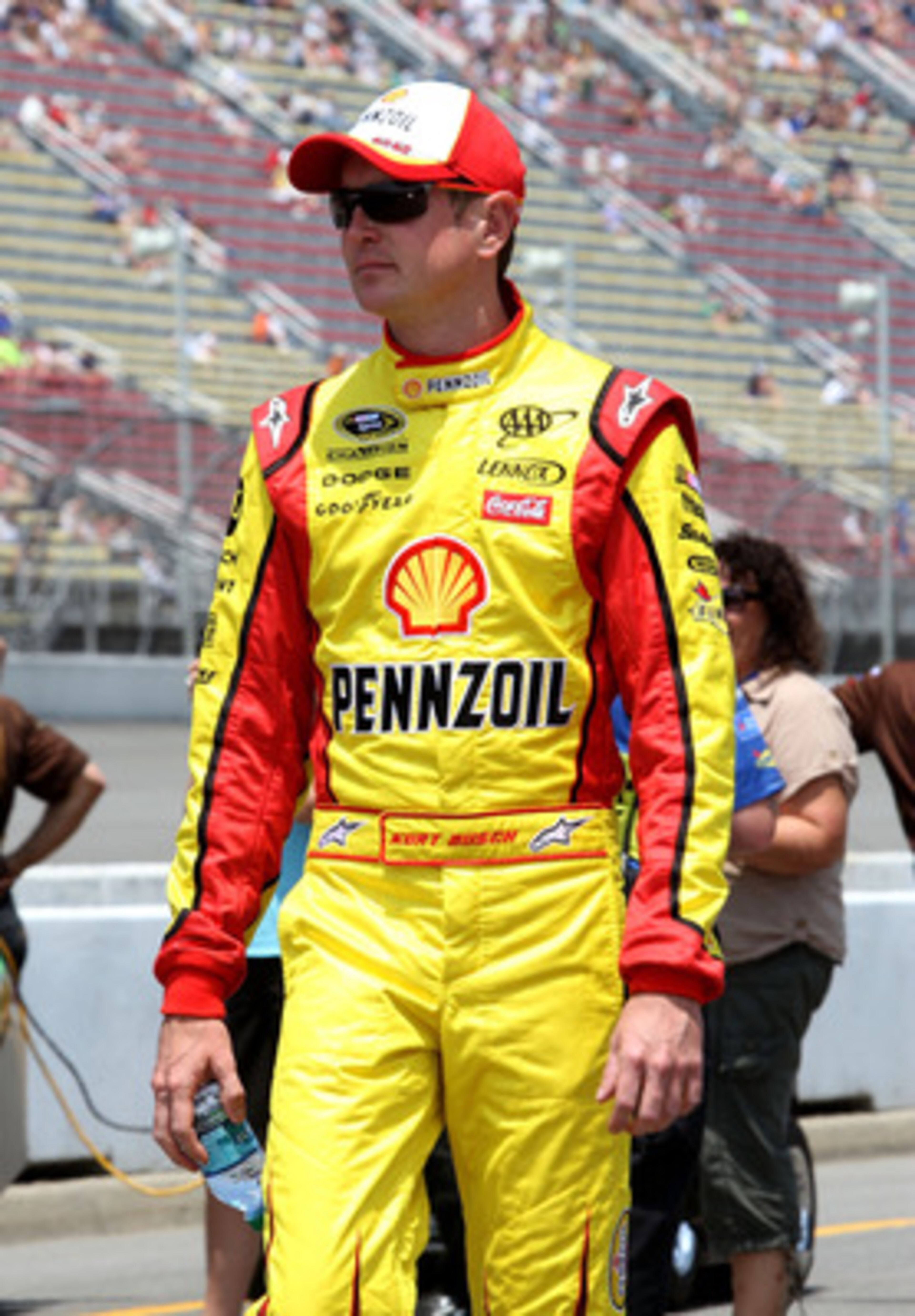BROOKLYN, MI - JUNE 18:  Kurt Busch, driver of the #22 Shell/Pennzoil Dodge, walks on pit road during qualifying for the NASCAR Sprint Cup Series Heluva Good! Sour Cream Dips 400 at Michigan International Speedway on June 18, 2011 in Brooklyn, Michigan.