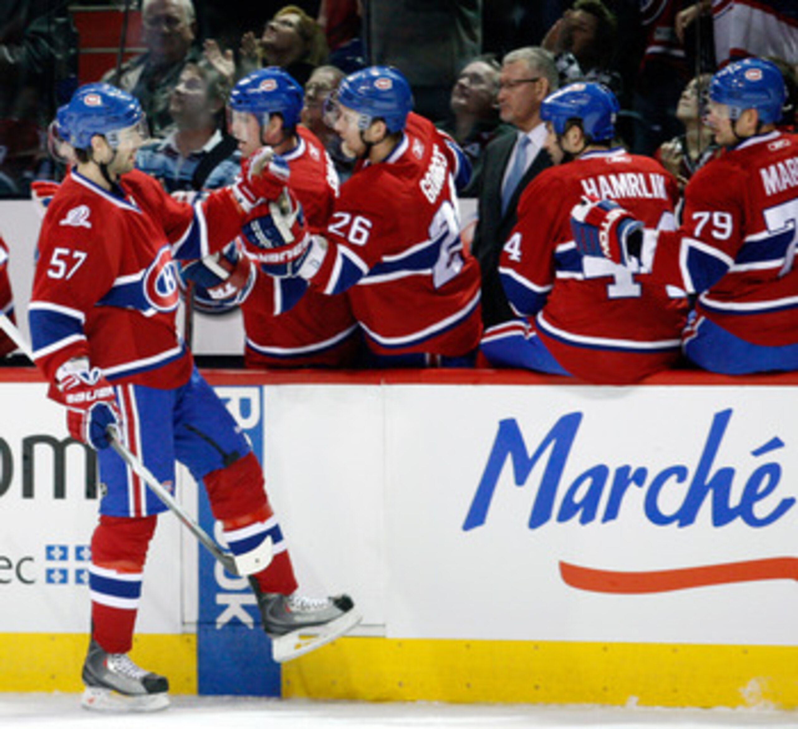 MONTREAL- JANUARY 16:  Benoit Pouliot #57 of the Montreal Canadiens celebrates his first period goal with the team mates during the NHL game against the Ottawa Senators on January 16, 2010 at the Bell Centre in Montreal, Quebec, Canada.  (Photo by Richard