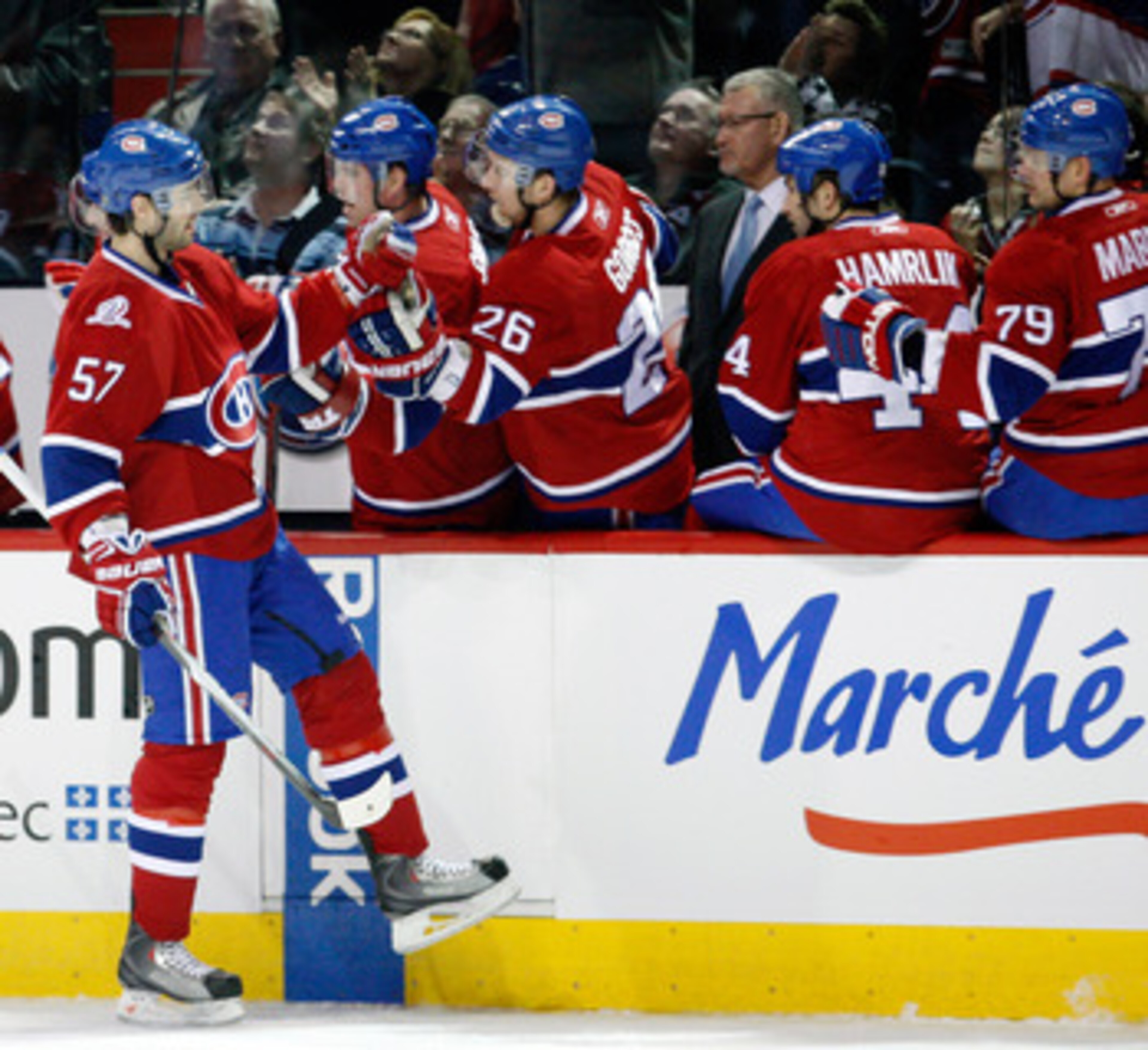 MONTREAL- JANUARY 16:  Benoit Pouliot #57 of the Montreal Canadiens celebrates his first period goal with the team mates during the NHL game against the Ottawa Senators on January 16, 2010 at the Bell Centre in Montreal, Quebec, Canada.  (Photo by Richard
