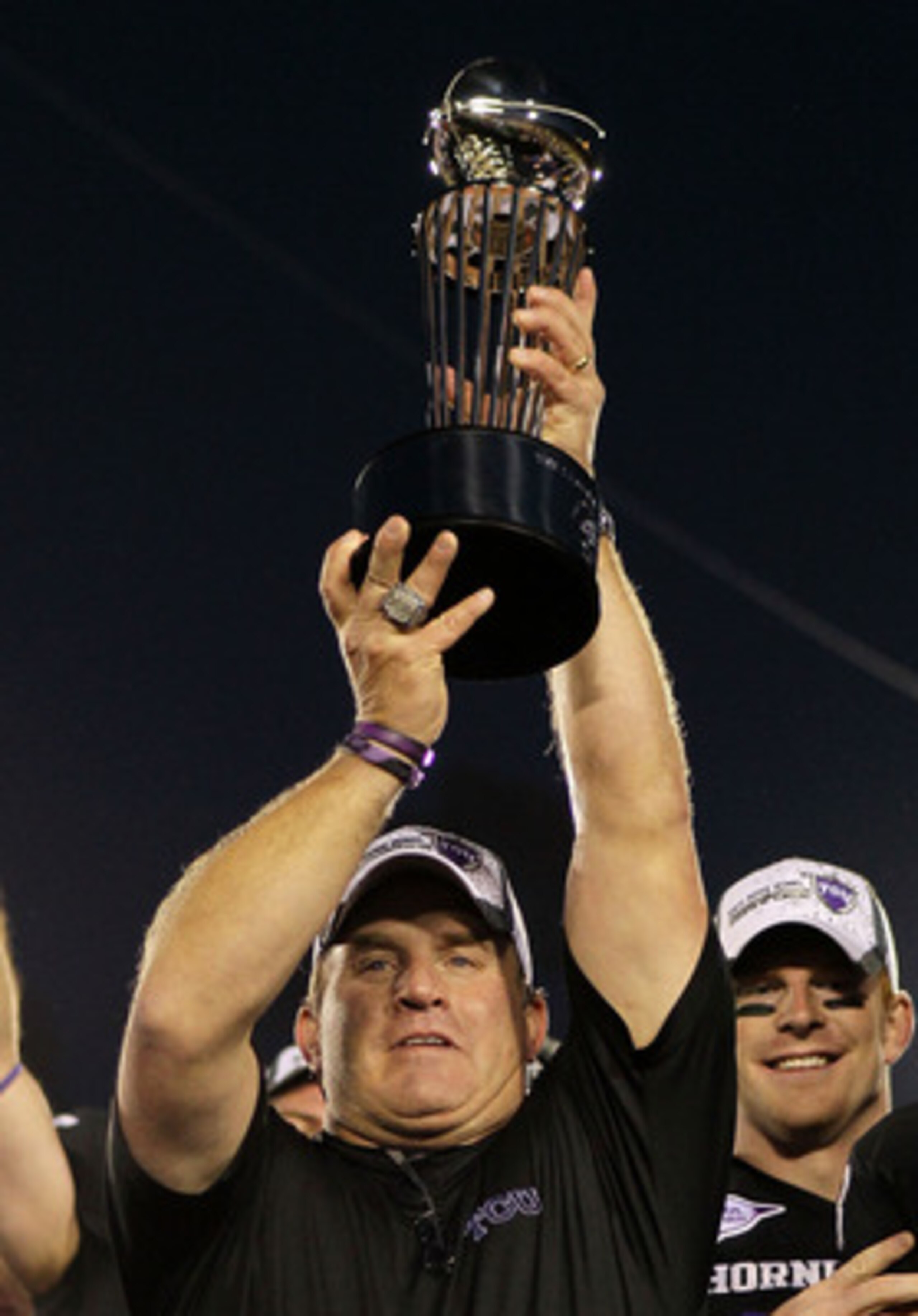 PASADENA, CA - JANUARY 01:  Head coach Gary Patterson of the TCU Horned Frogs holds the Rose Bowl Championship Trophy after defeating the Wisconsin Badgers 21-19 in the 97th Rose Bowl game on January 1, 2011 in Pasadena, California.  (Photo by Jeff Gross/