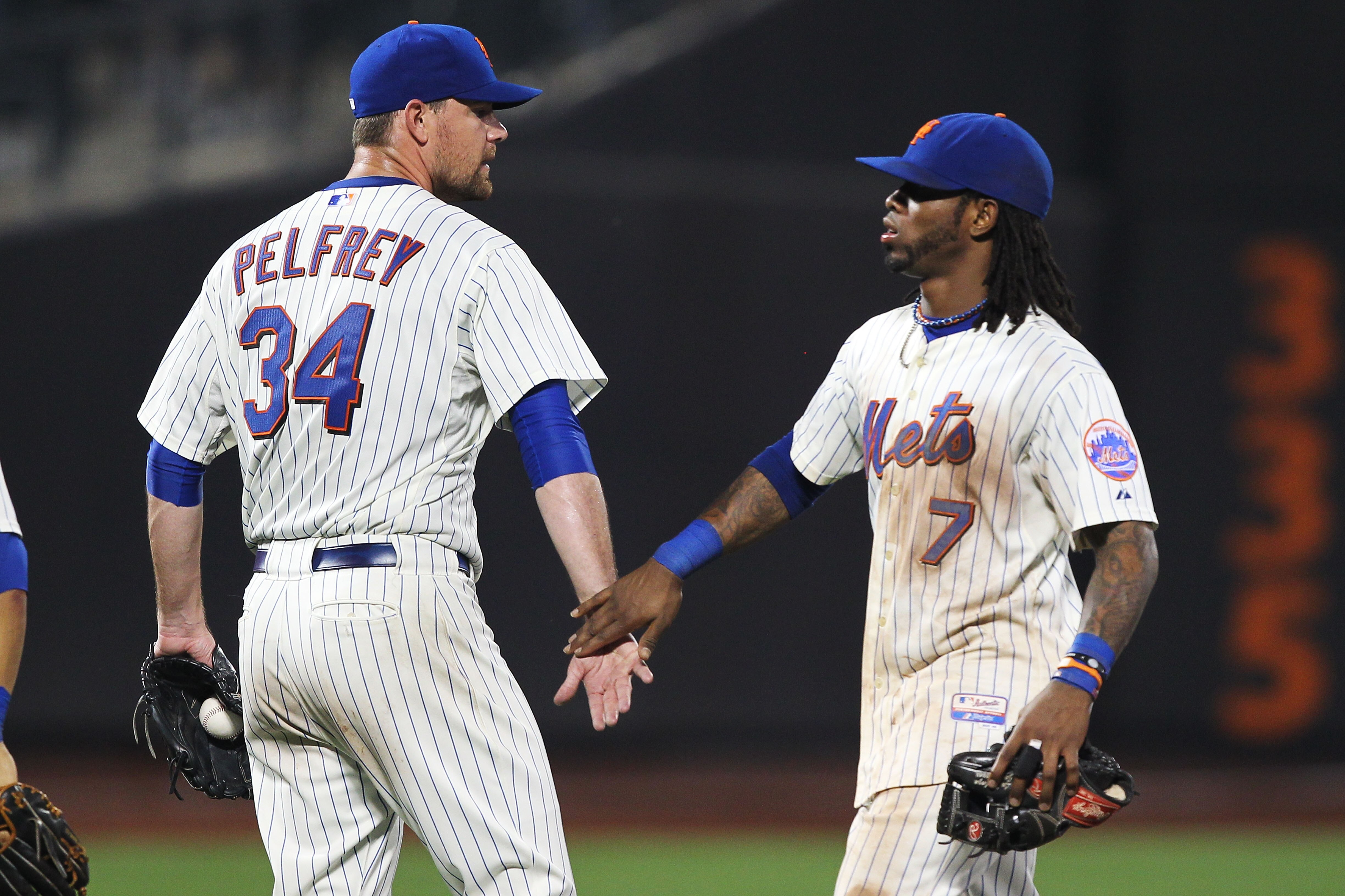 NEW YORK, NY - JUNE 18:  Mike Pelfrey #34 of the New York Mets celebrates a complete game win with Jose Reyes #7 after their 6-1 victory against the Los Angeles Angels of Anaheim on June 18, 2011 at Citi Field in the Flushing neighborhood of the Queens bo
