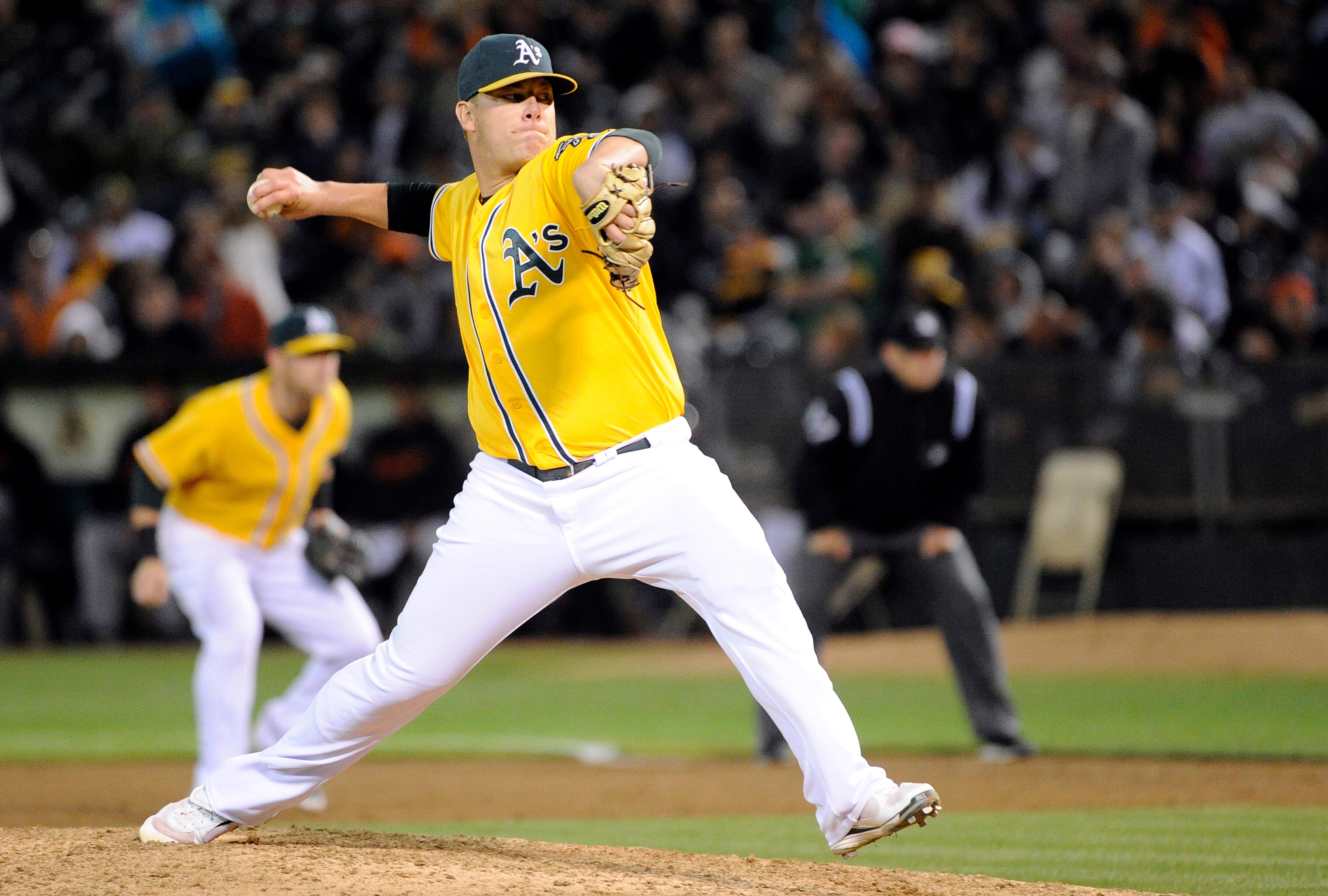 OAKLAND, CA -  JUNE 18: Andrew Bailey #40 of the Oakland Athletics pitches in the ninth inning against the San Francisco Giants during a MLB baseball game June 18, 2011 at the Oakland-Alameda County Coliseum in Oakland, California. The Athletics won the g