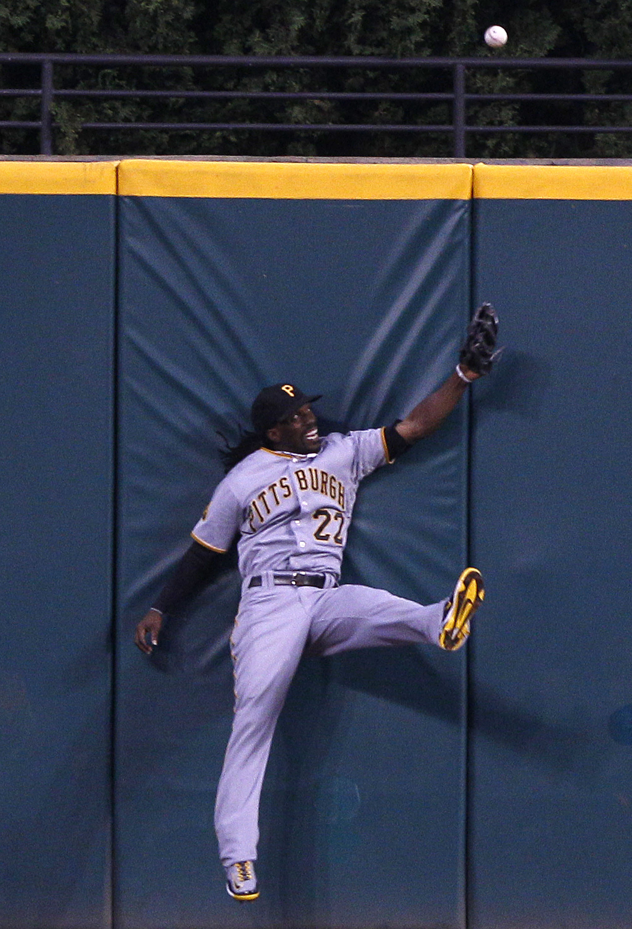 CLEVELAND, OH - JUNE 18:   Andrew McCutchen #22 of the Pittsburgh Pirates is unable to make the play on a ball hit for a triple by Grady Sizemore #24 of the Cleveland Indians during the seventh  inning of their game on June 18, 2011 at Progressive Field i