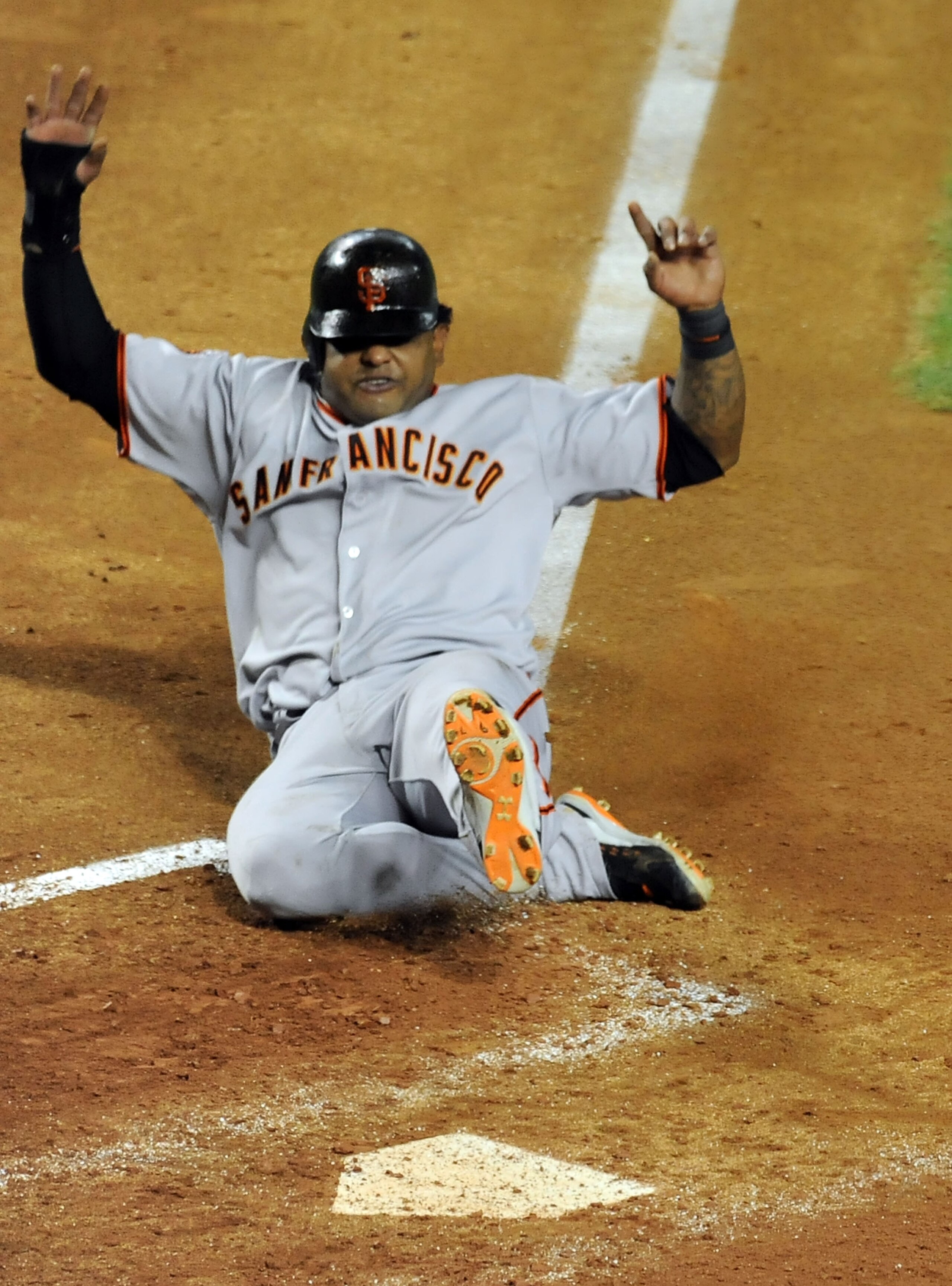 PHOENIX - JUNE 16:  Pablo Sandoval #48 of the San Francisco Giants slides into home plate against the Arizona Diamondbacks at Chase Field on June 16, 2011 in Phoenix, Arizona.  (Photo by Norm Hall/Getty Images)