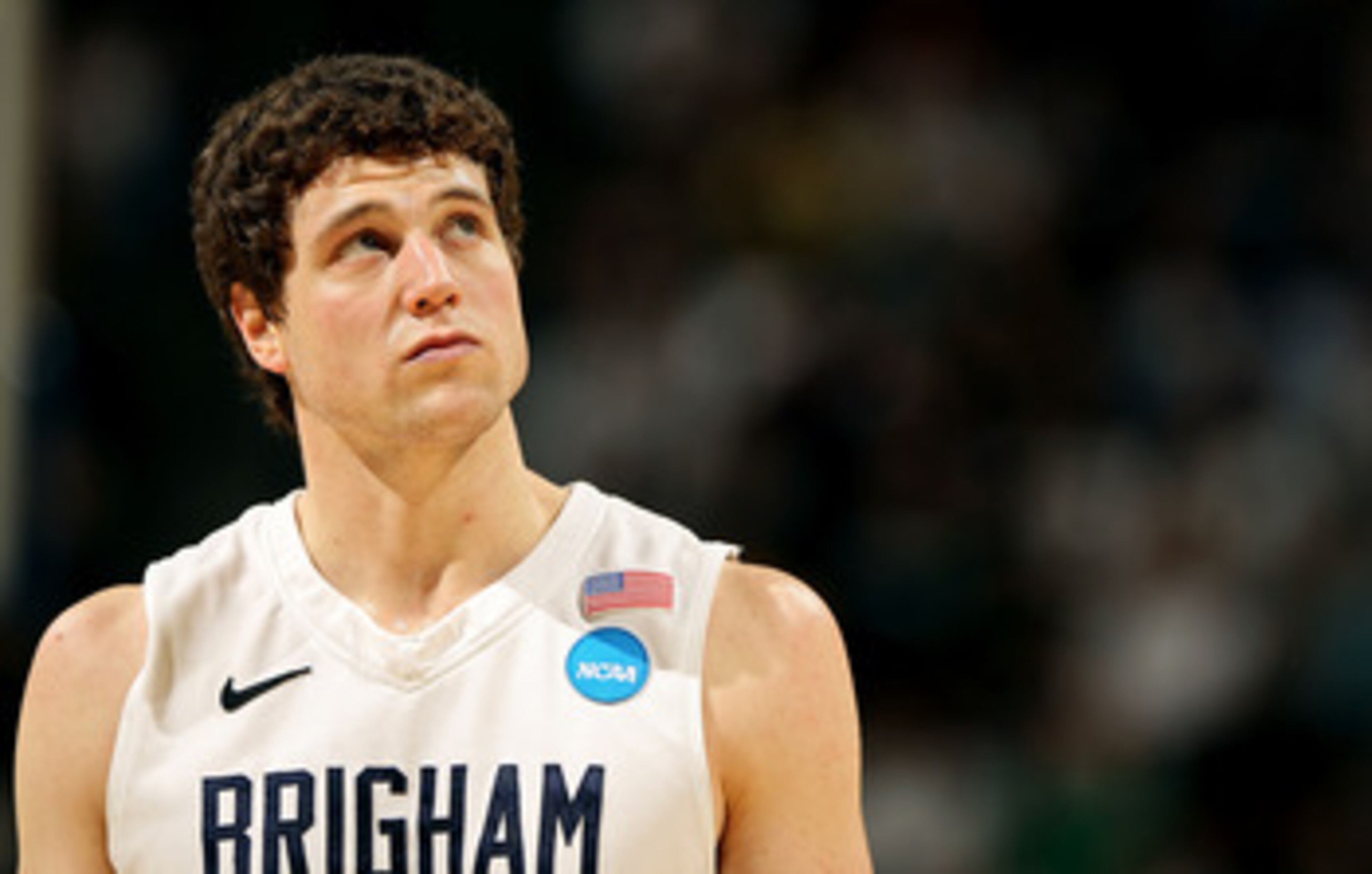 DENVER, CO - MARCH 19:  Jimmer Fredette #32 of the Brigham Young Cougars looks on against the Gonzaga Bulldogs during the third round of the 2011 NCAA men's basketball tournament at Pepsi Center on March 19, 2011 in Denver, Colorado.  (Photo by Doug Pensi