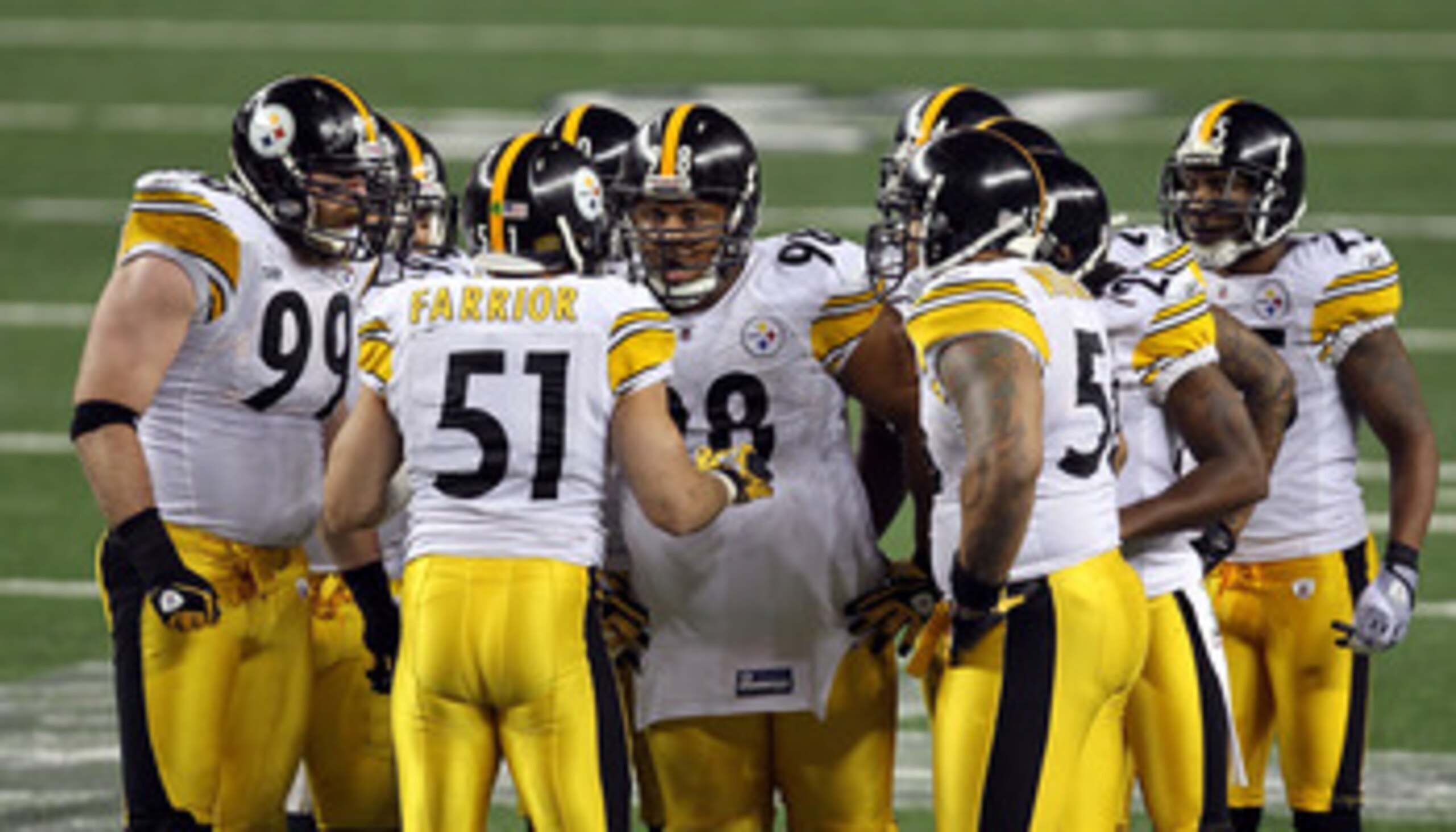 ARLINGTON, TX - FEBRUARY 06:  James Farrior #51 of the Pittsburgh Steelers calls a play in the defensive huddle as Brett Keisel #99 and Casey Hampton #98 (c) look on against the Green Bay Packers during Super Bowl XLV at Cowboys Stadium on February 6, 201