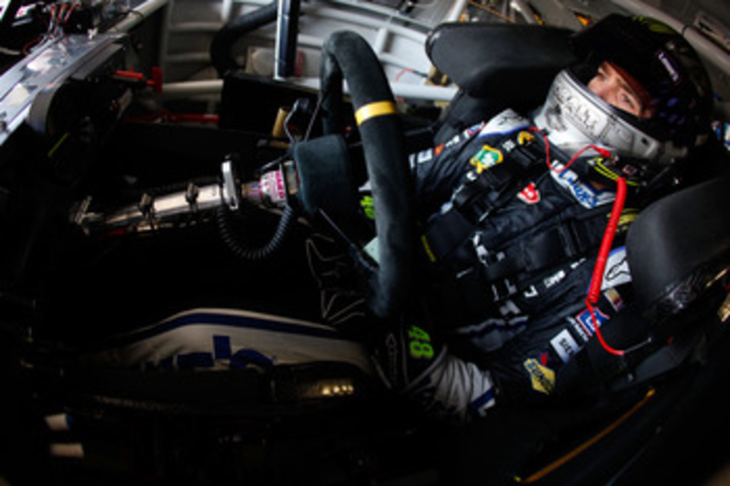 BROOKLYN, MI - JUNE 17:  Jimmie Johnson, driver of the #48 Lowe's/Kobalt Tools Chevrolet, sits in his car during practice for the NASCAR Sprint Cup Series Heluva Good! Sour Cream Dips 400 at Michigan International Speedway on June 17, 2011 in Brooklyn, Mi