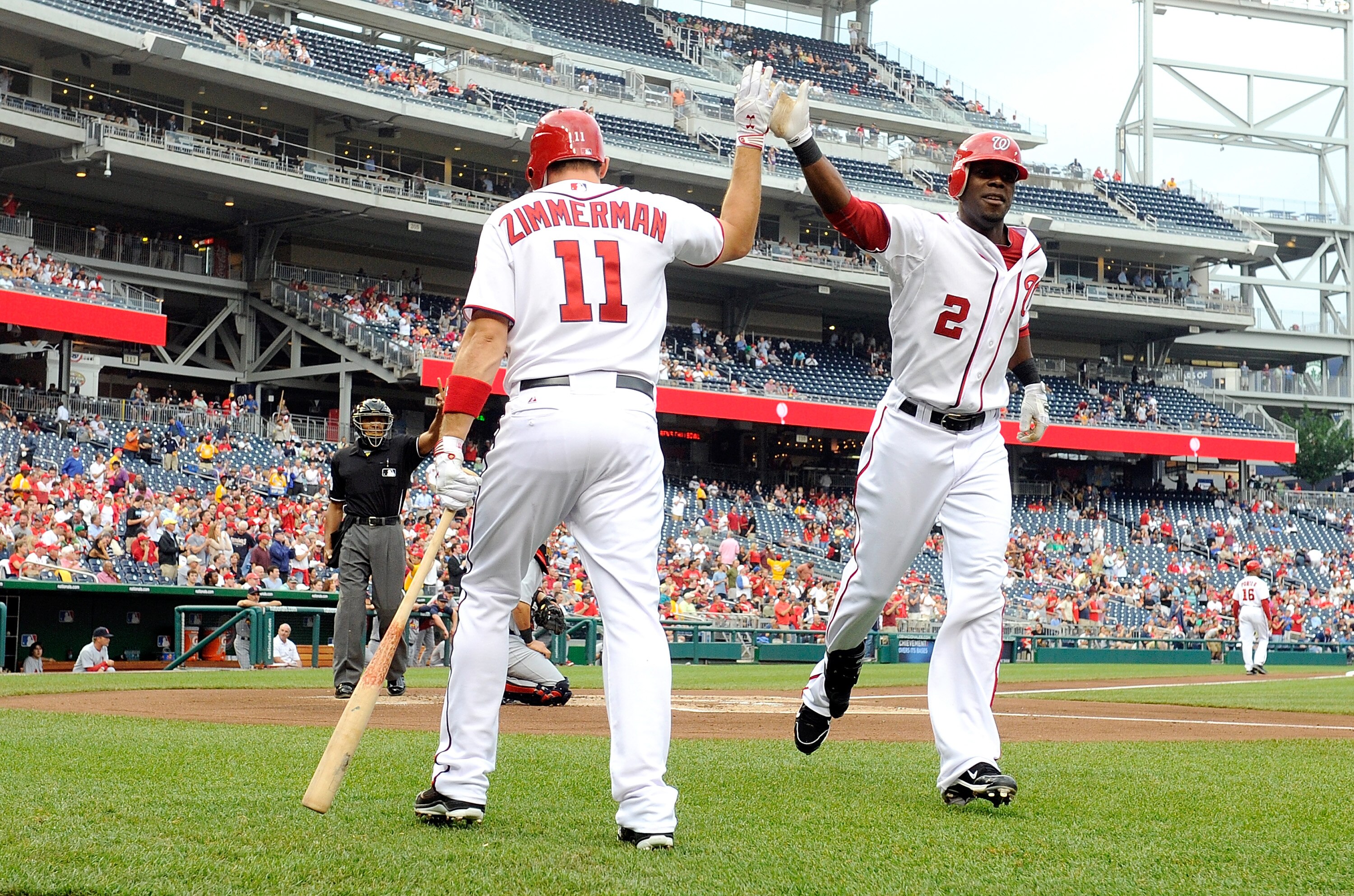 WASHINGTON, DC - JUNE 16:  Roger Bernadina #2 of the Washington Nationals celebrates with Ryan Zimmerman #11 after hitting a home run in the first inning against the St. Louis Cardinals at Nationals Park on June 16, 2011 in Washington, DC.  (Photo by Greg