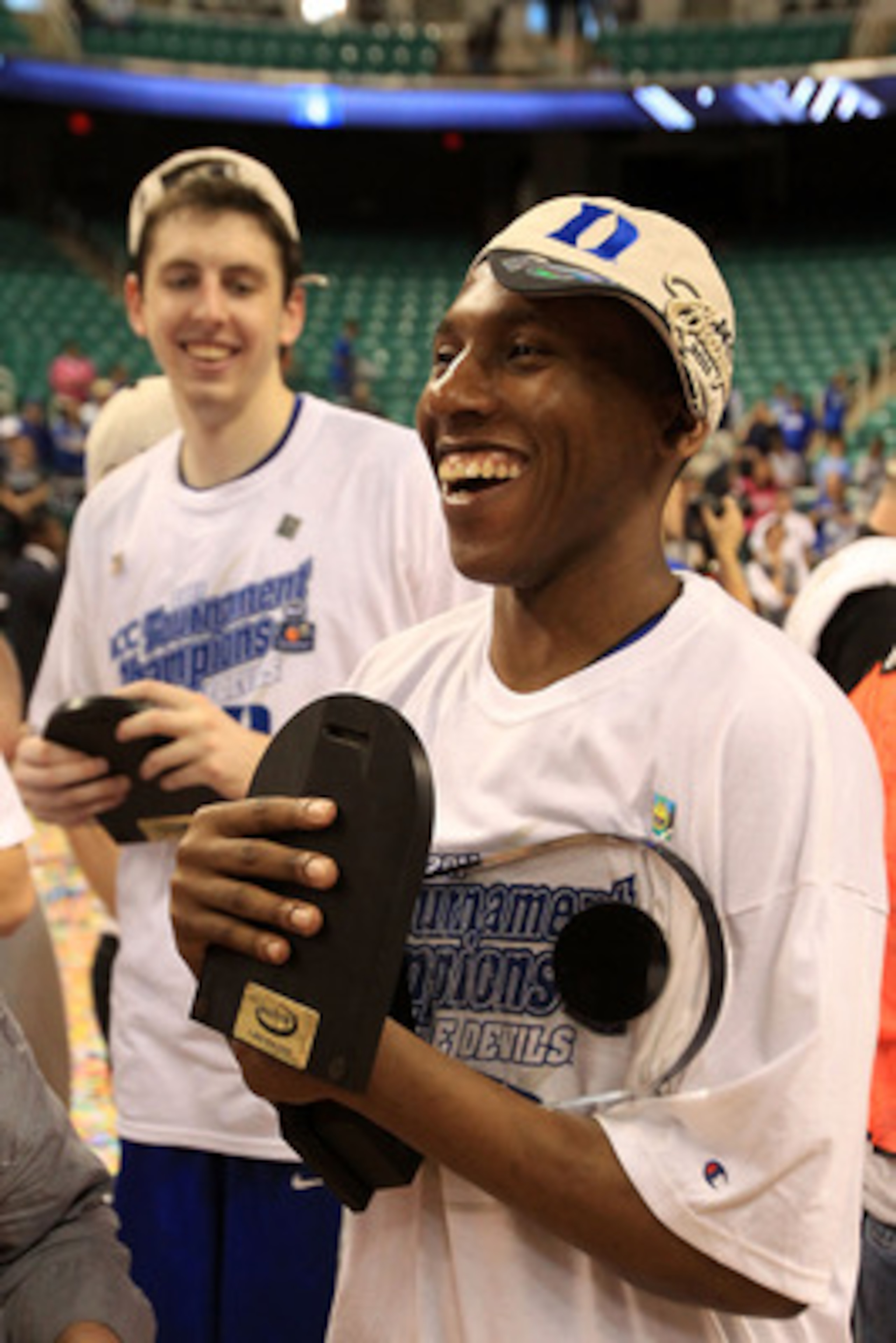 GREENSBORO, NC - MARCH 13:  Nolan Smith #2 of the Duke Blue Devils celebrates after being named MVP and defeating the North Carolina Tar Heels 75-58 in the championship game of the 2011 ACC men's basketball tournament at the Greensboro Coliseum on March 1