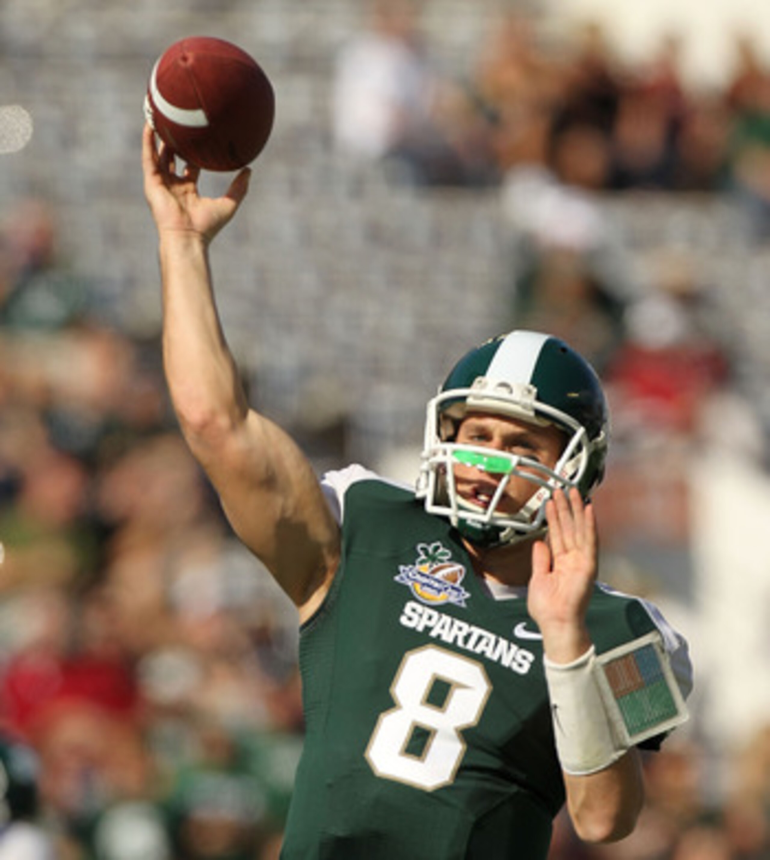 ORLANDO, FL - JANUARY 01: Kirk Cousins #8  of the Michigan State Spartans warms up during the Capitol One Bowl against the Alabama Crimson Tide at the Florida Citrus Bowl on January 1, 2011 in Orlando, Florida.  (Photo by Mike Ehrmann/Getty Images)