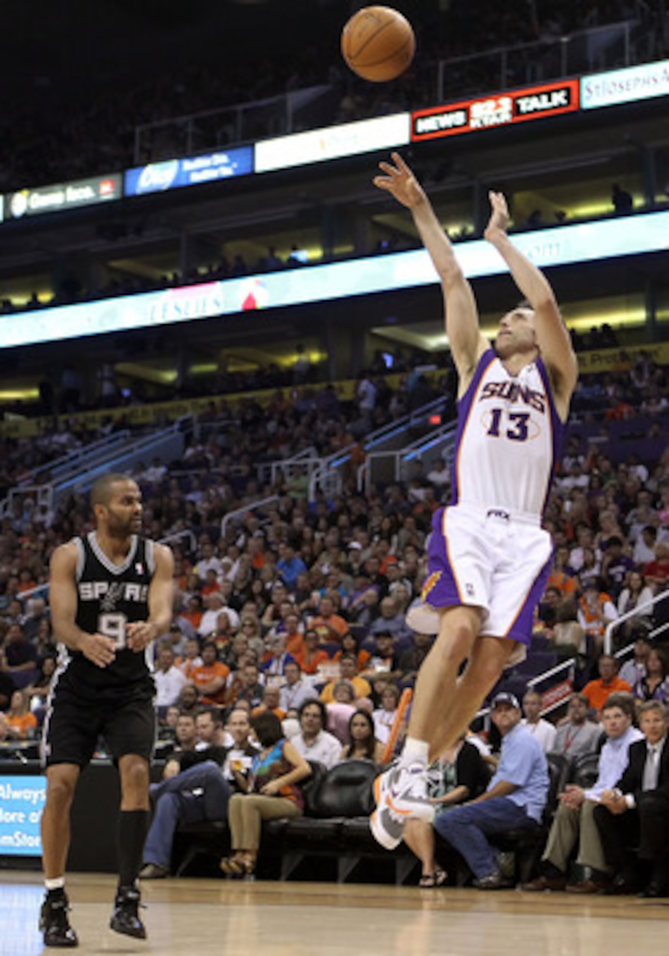 PHOENIX, AZ - APRIL 13:  Steve Nash #13 of the Phoenix Suns puts up a shot against the San Antonio Spurs during the NBA game at US Airways Center on April 13, 2011 in Phoenix, Arizona.  NOTE TO USER: User expressly acknowledges and agrees that, by downloa
