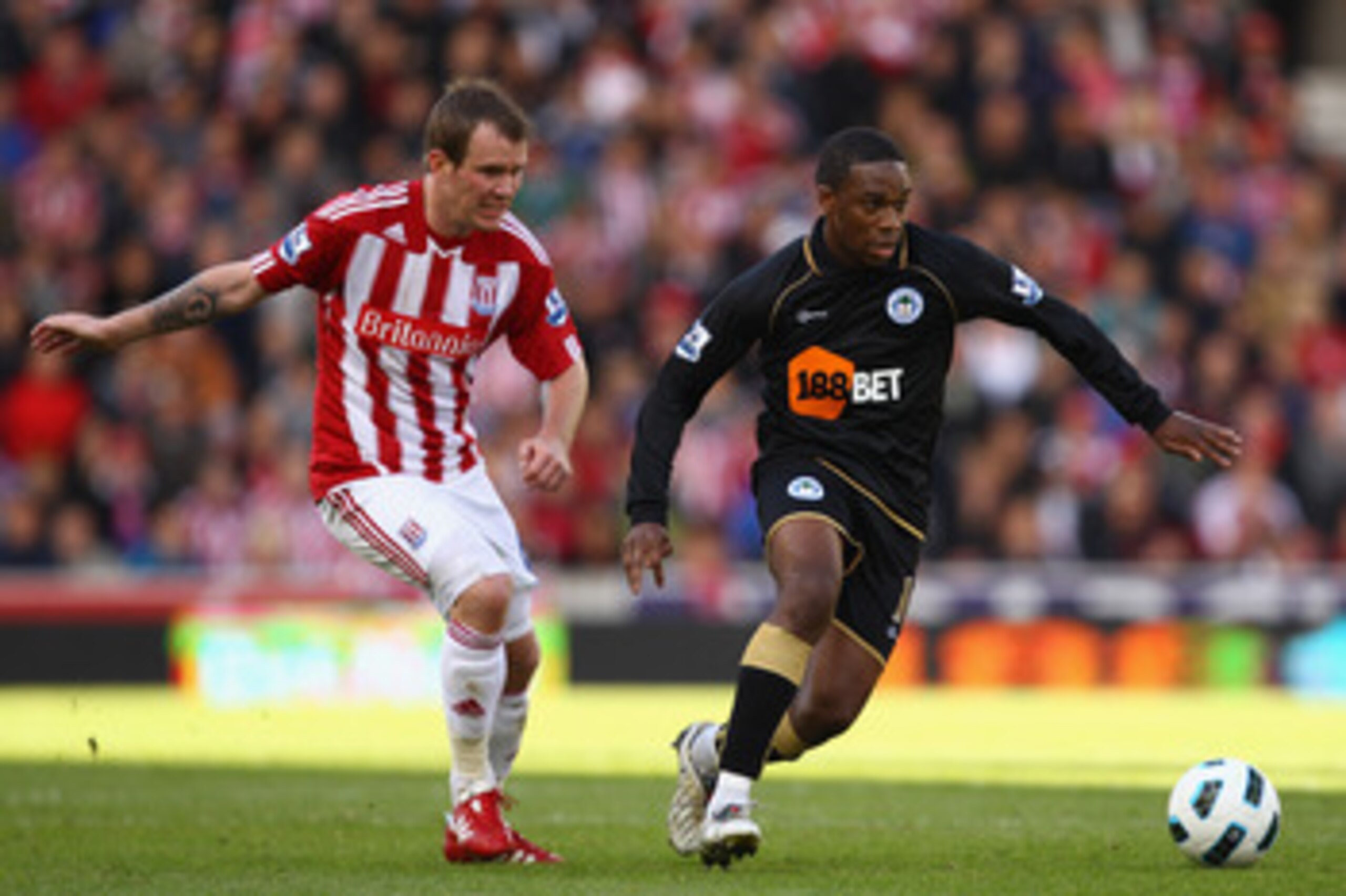 STOKE ON TRENT, ENGLAND - MAY 22: Charles N'Zogbia of Wigan battles for the ball with Glenn Whelan of Stoke during the Barclays Premier League match between Stoke City and Wigan Athletic at Britannia Stadium on May 22, 2011 in Stoke on Trent, England.  (P