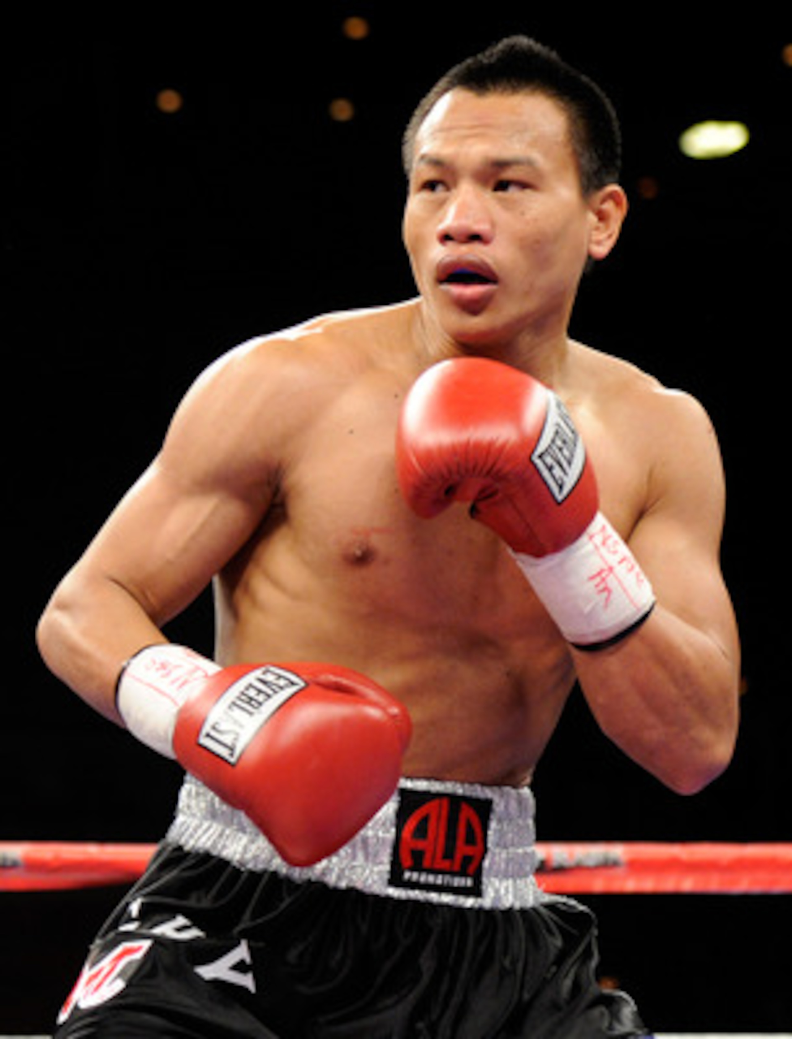 LAS VEGAS, NV - FEBRUARY 19:  Mark Melligen of the Philippines fights Gabriel Martinez of Mexico during the first round of their welterweight bout at the Mandalay Bay Events Center February 19, 2011 in Las Vegas, Nevada. Melligen won by unanimous decision