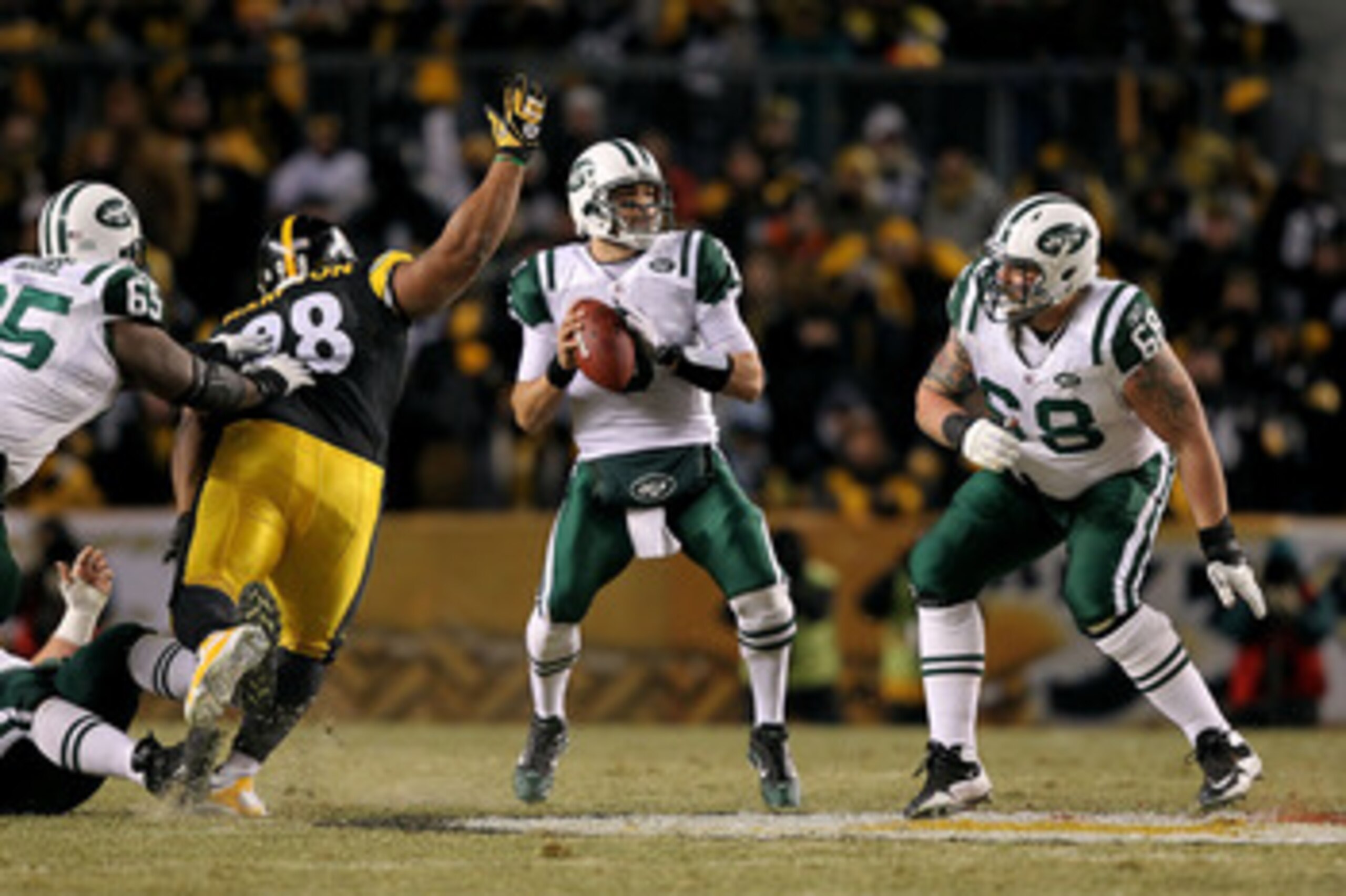 PITTSBURGH, PA - JANUARY 23:  Mark Sanchez #6 of the New York Jets scrambles against Casey Hampton #98 of the Pittsburgh Steelers during the 2011 AFC Championship game at Heinz Field on January 23, 2011 in Pittsburgh, Pennsylvania.  (Photo by Al Bello/Get