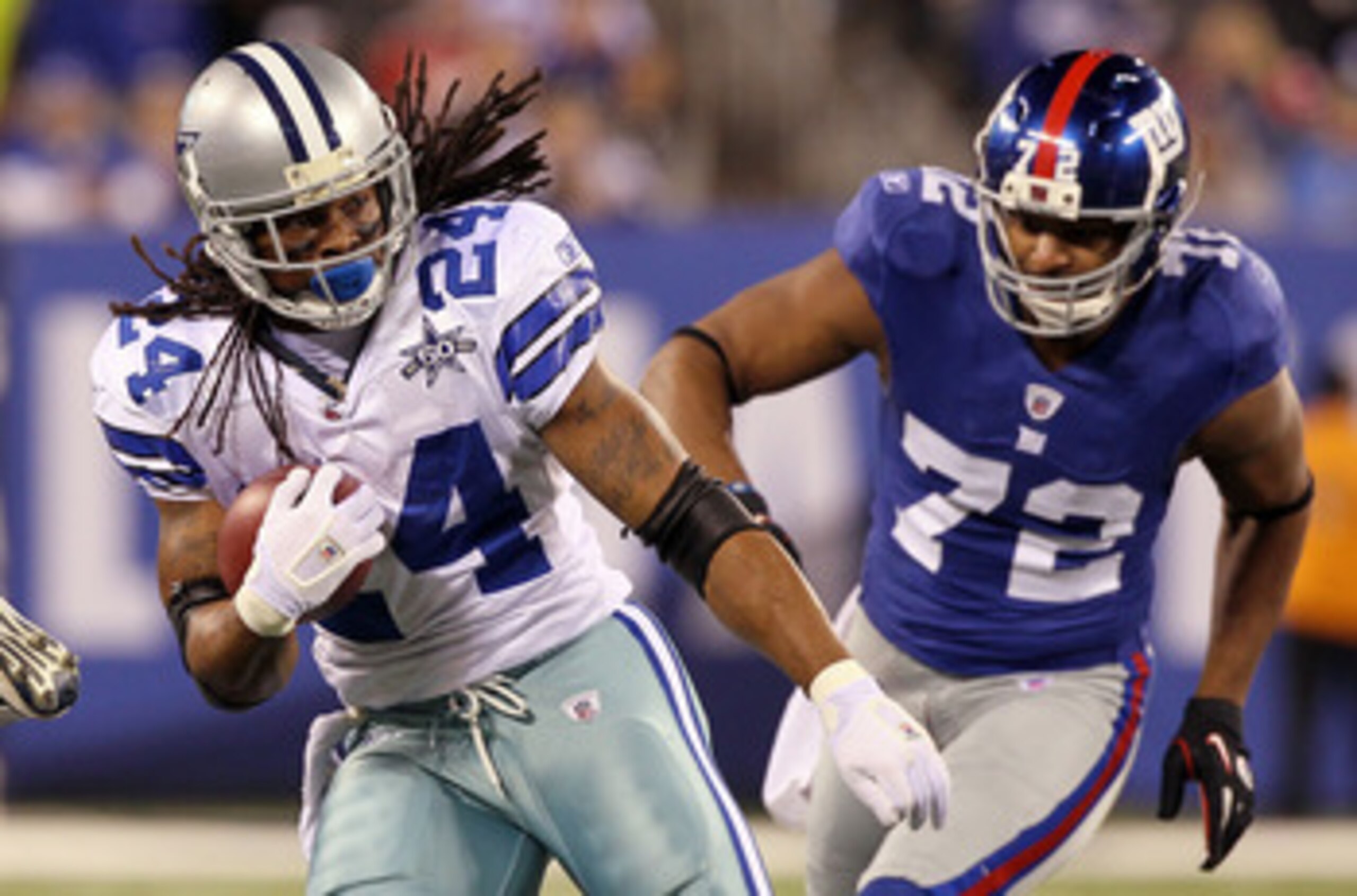 EAST RUTHERFORD, NJ - NOVEMBER 14:  Marion Barber #24 of the Dallas Cowboys runs the ball past Osi Umenyiora #72 of the New York Giants on November 14, 2010 at the New Meadowlands Stadium in East Rutherford, New Jersey. The Cowboys defeated the Giants 33-