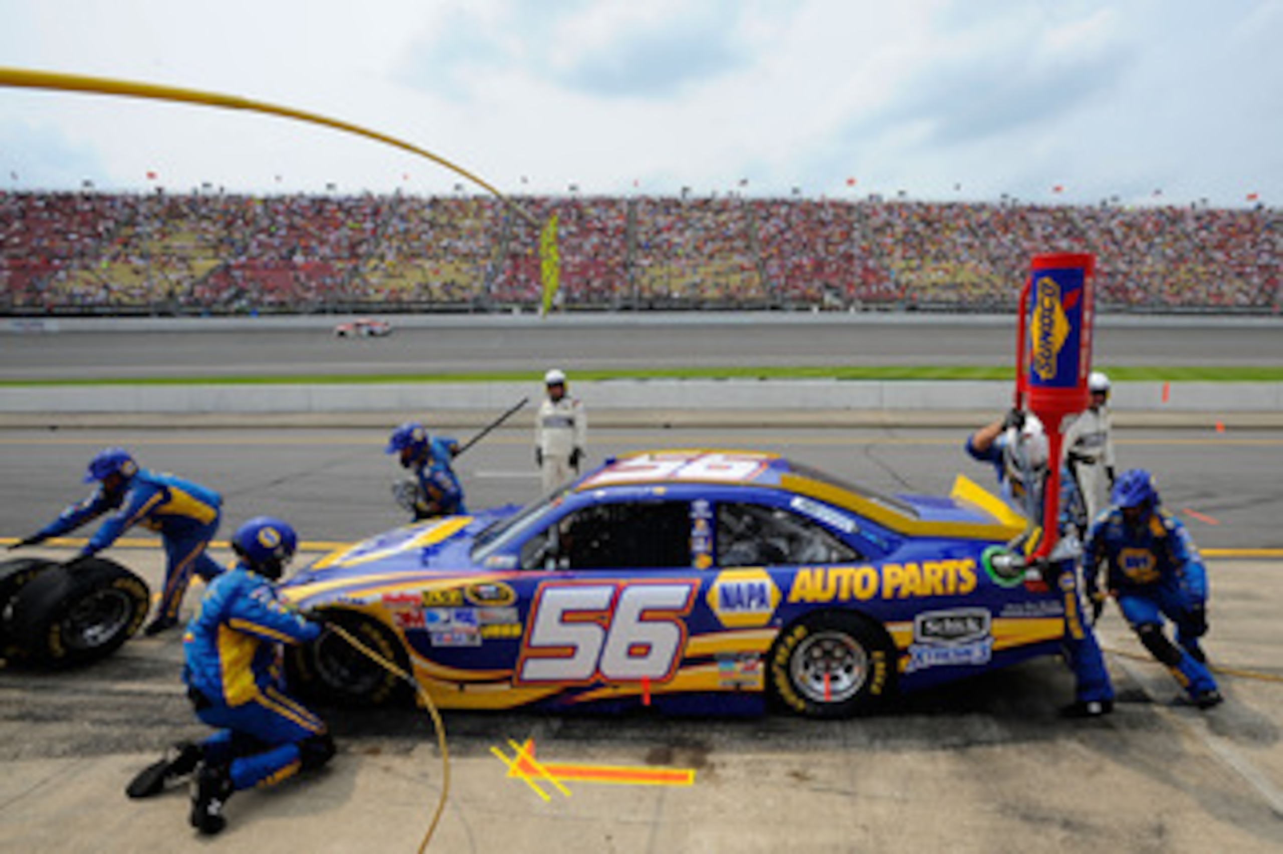 BROOKLYN, MI - JUNE 19:  Martin Truex Jr., driver of the #56 NAPA Auto Parts Toyota, makes a pit stop during the NASCAR Sprint Cup Series Heluva Good! Sour Cream Dips 400 at Michigan International Speedway on June 19, 2011 in Brooklyn, Michigan.  (Photo b