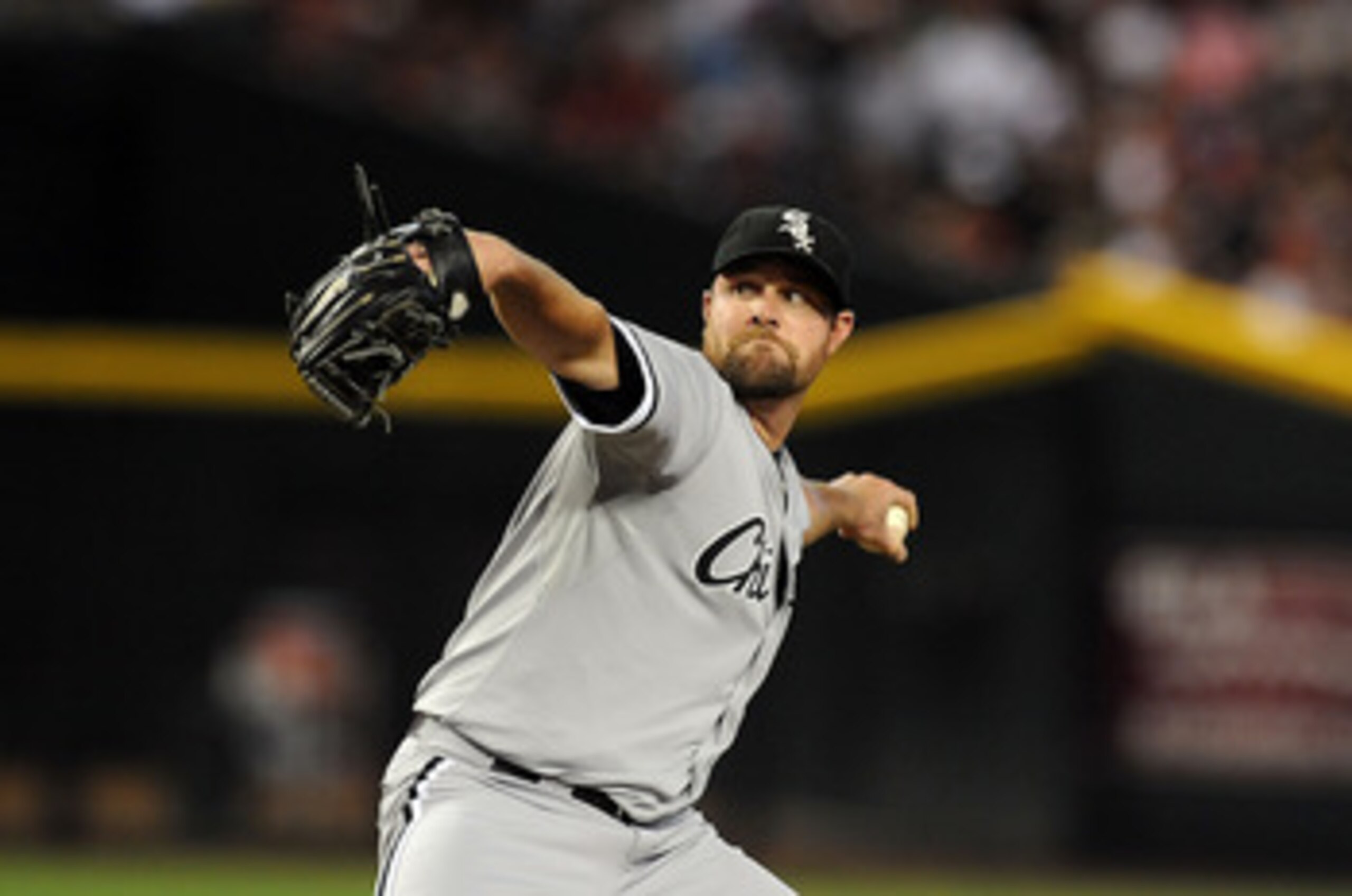 PHOENIX, AZ - JUNE 18:  Starting pitcher John Danks #50 of the Chicago White Sox delivers a pitch in the first inning against the Arizona Diamondbacks at Chase Field on June 18, 2011 in Phoenix, Arizona.  (Photo by Norm Hall/Getty Images)