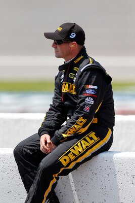 BROOKLYN, MI - JUNE 18:  Marcos Ambrose, driver of the #9 Dewalt Ford, sits on pit road during qualifying for the NASCAR Sprint Cup Series Heluva Good! Sour Cream Dips 400 at Michigan International Speedway on June 18, 2011 in Brooklyn, Michigan.  (Photo 