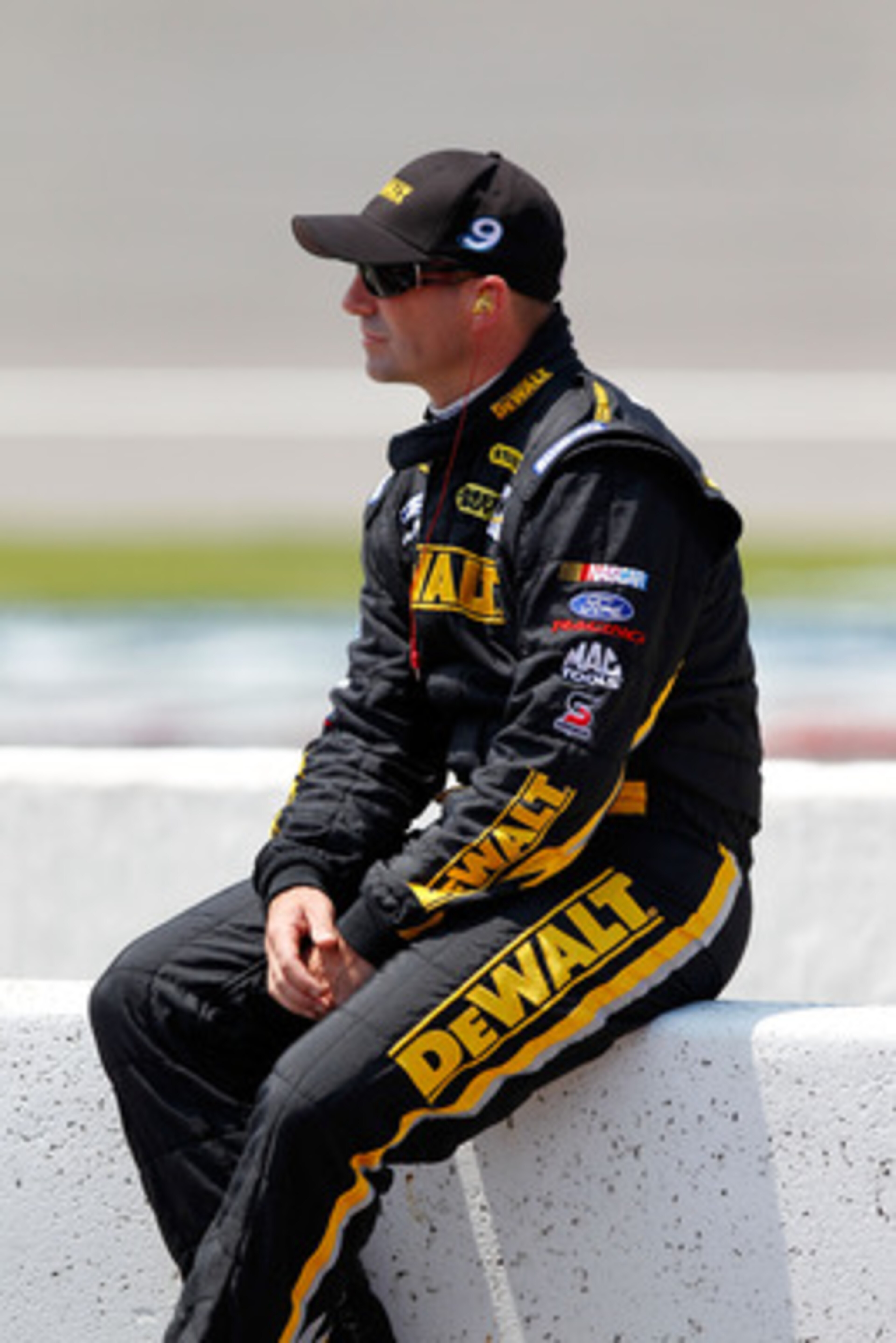 BROOKLYN, MI - JUNE 18:  Marcos Ambrose, driver of the #9 Dewalt Ford, sits on pit road during qualifying for the NASCAR Sprint Cup Series Heluva Good! Sour Cream Dips 400 at Michigan International Speedway on June 18, 2011 in Brooklyn, Michigan.  (Photo 