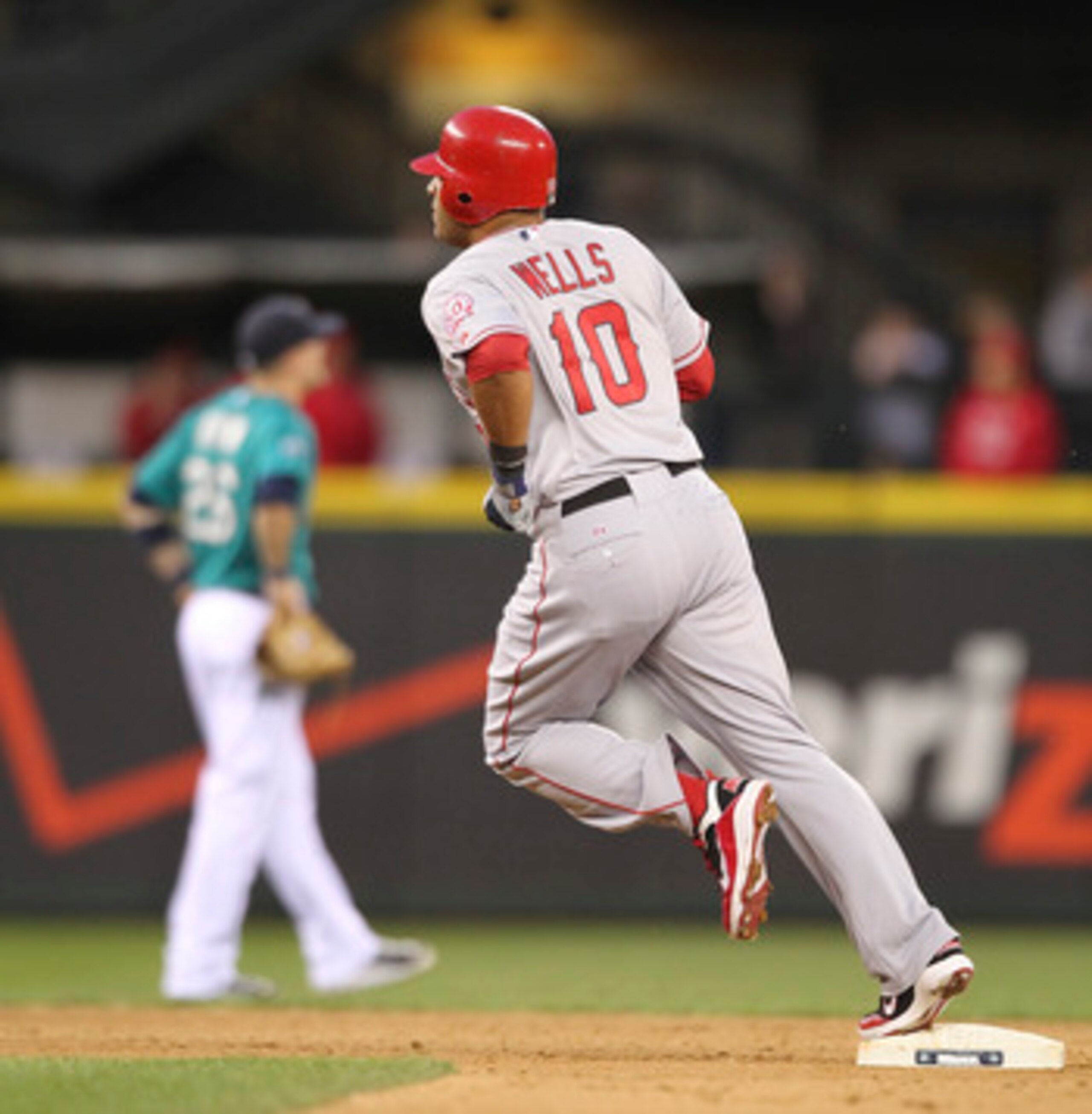 SEATTLE - JUNE 13:  Vernon Wells #10 of the Los Angeles Angels of Anaheim rounds second base after hitting a two-run homer in the seventh inning against the Seattle Mariners at Safeco Field on June 13, 2011 in Seattle, Washington. (Photo by Otto Greule Jr
