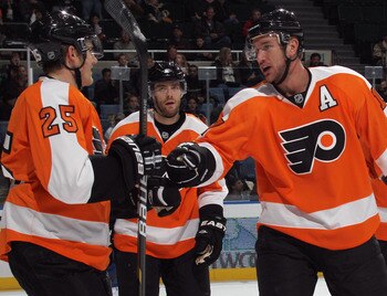 UNIONDALE, NY - DECEMBER 05: Matt Carle #25 of the Philadelphia Flyers scores at 13:42 of the first period against the New York Islanders and is joined by Jeff Carter #17 (R) at the Nassau Coliseum on December 5, 2010 in Uniondale, New York. (Photo by Br UNIONDALE, NY - DECEMBER 05: Matt Carle #25 of the Philadelphia Flyers scores at 13:42 of the first period against the New York Islanders and is joined by Jeff Carter #17 (R) at the Nassau Coliseum on December 5, 2010 in Uniondale, New York. (Photo by Br