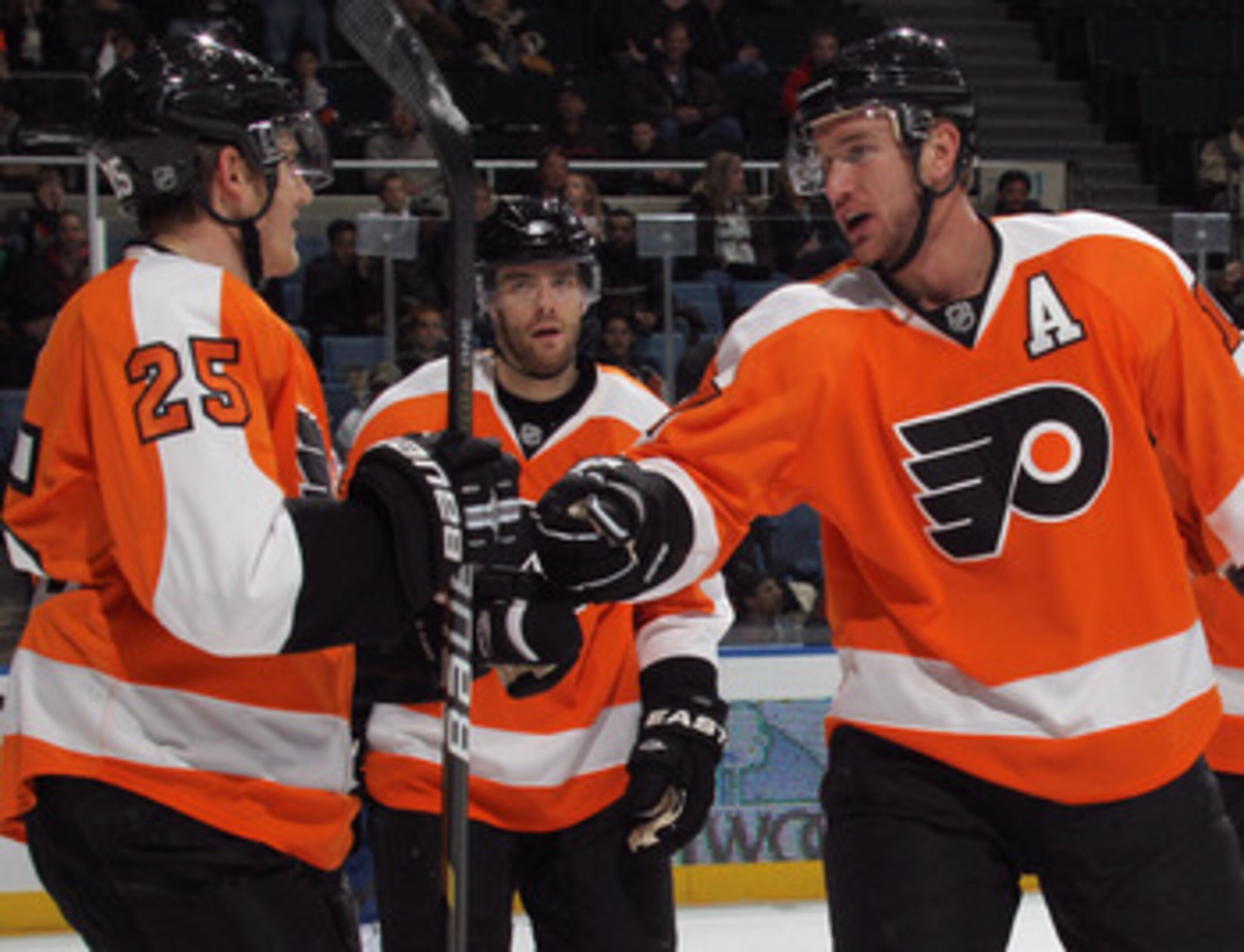 UNIONDALE, NY - DECEMBER 05: Matt Carle #25 of the Philadelphia Flyers scores at 13:42 of the first period against the New York Islanders and is joined by Jeff Carter #17 (R) at the Nassau Coliseum on December 5, 2010 in Uniondale, New York.  (Photo by Br