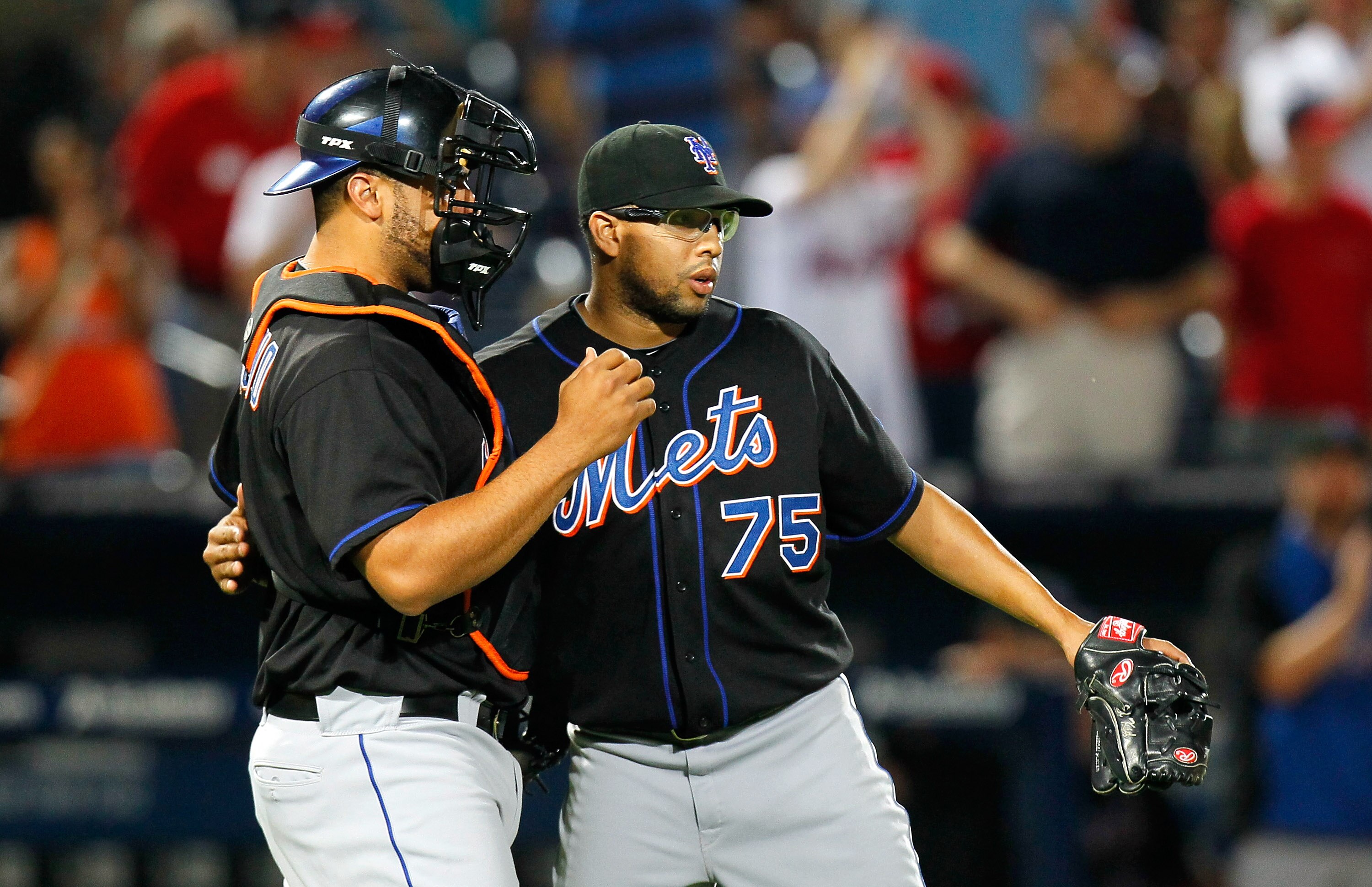 ATLANTA, GA - JUNE 14:  Francisco Rodriguez #75 and Ronny Paulino #9 of the New York Mets celebrate after their 4-3 win over the Atlanta Braves at Turner Field on June 14, 2011 in Atlanta, Georgia.  (Photo by Kevin C. Cox/Getty Images)