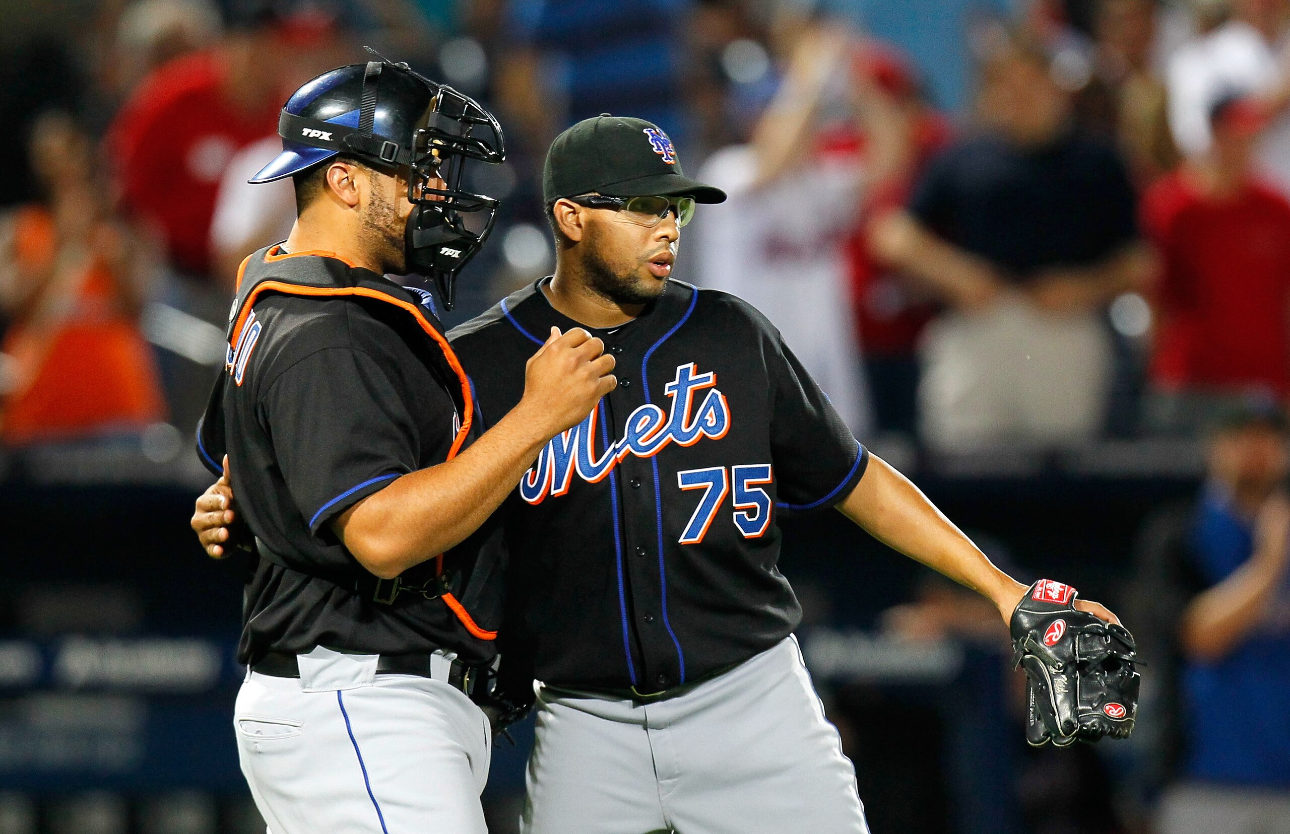 ATLANTA, GA - JUNE 14:  Francisco Rodriguez #75 and Ronny Paulino #9 of the New York Mets celebrate after their 4-3 win over the Atlanta Braves at Turner Field on June 14, 2011 in Atlanta, Georgia.  (Photo by Kevin C. Cox/Getty Images)