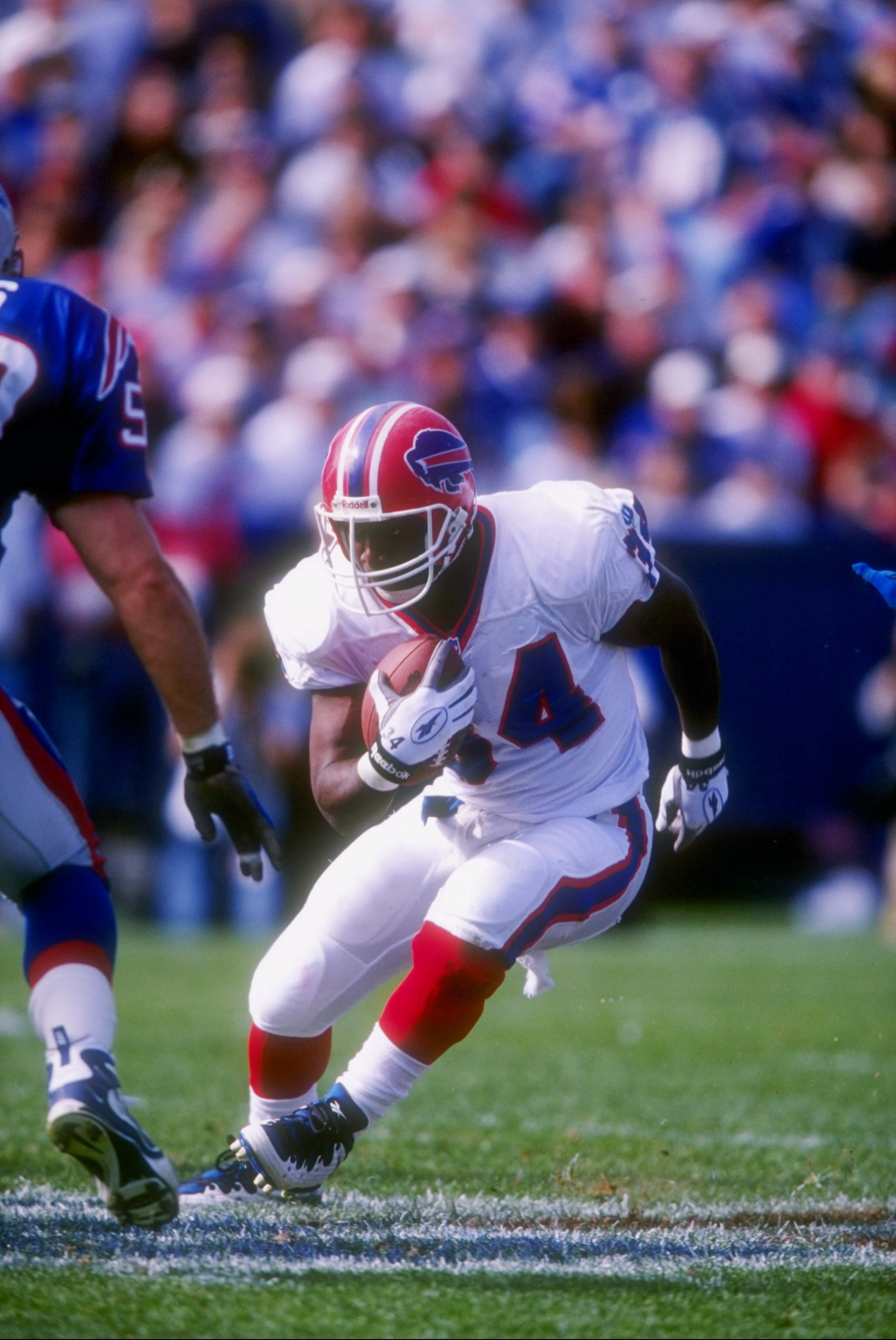 12 Oct 1997: Running back Thurman Thomas of the Buffalo Bills runs with the ball during a game against the New England Patriots at Foxboro Stadium in Foxboro, Massachusetts. The Patriots won the game 33-6.