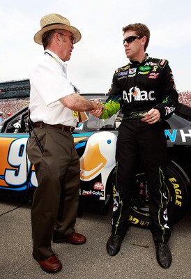 BROOKLYN, MI - JUNE 19:  Carl Edwards, driver of the #99 Aflac Ford, greets team owner Jack Roush prior to the NASCAR Sprint Cup Series Heluva Good! Sour Cream Dips 400 at Michigan International Speedway on June 19, 2011 in Brooklyn, Michigan.  (Photo by 