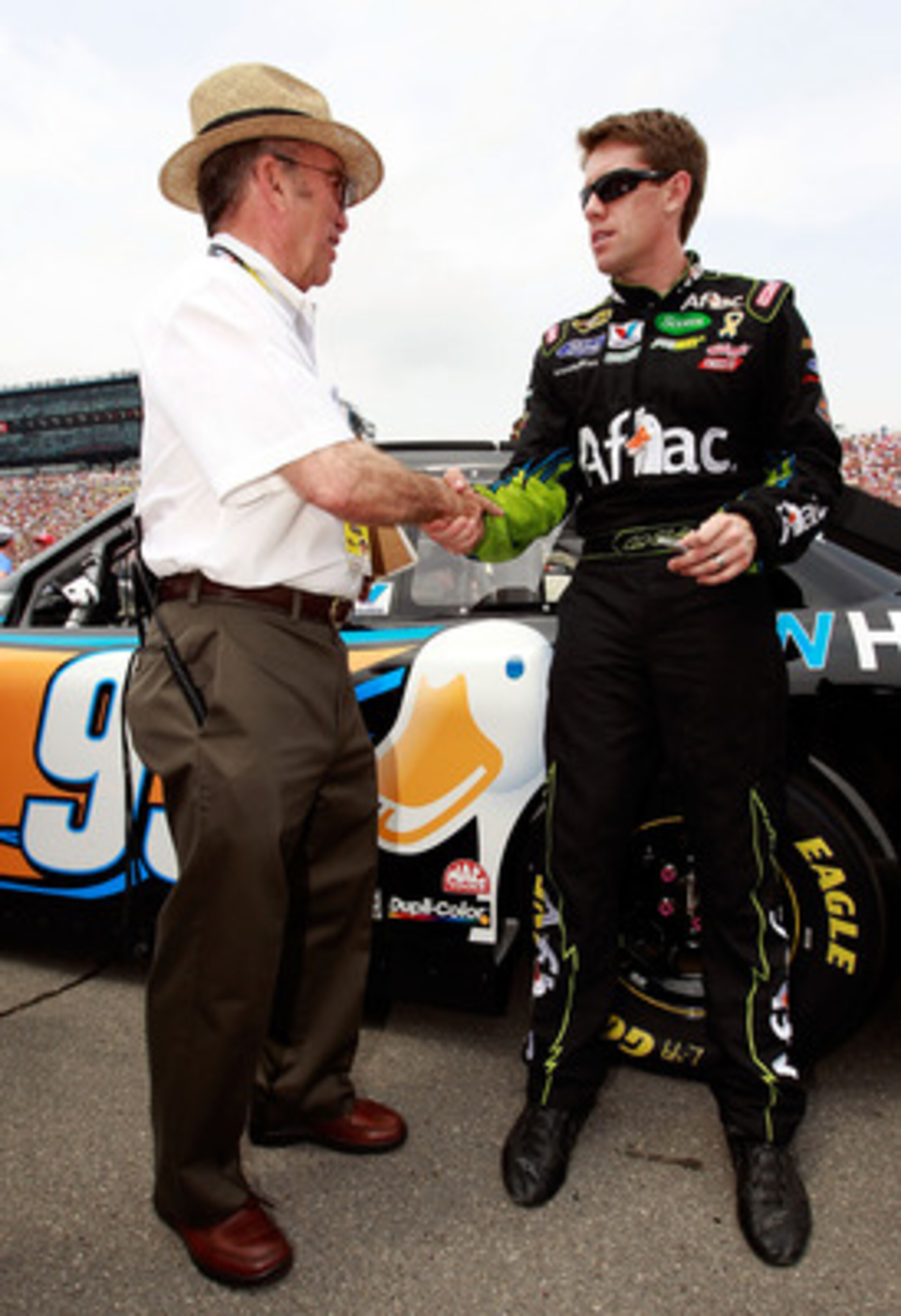 BROOKLYN, MI - JUNE 19:  Carl Edwards, driver of the #99 Aflac Ford, greets team owner Jack Roush prior to the NASCAR Sprint Cup Series Heluva Good! Sour Cream Dips 400 at Michigan International Speedway on June 19, 2011 in Brooklyn, Michigan.  (Photo by 