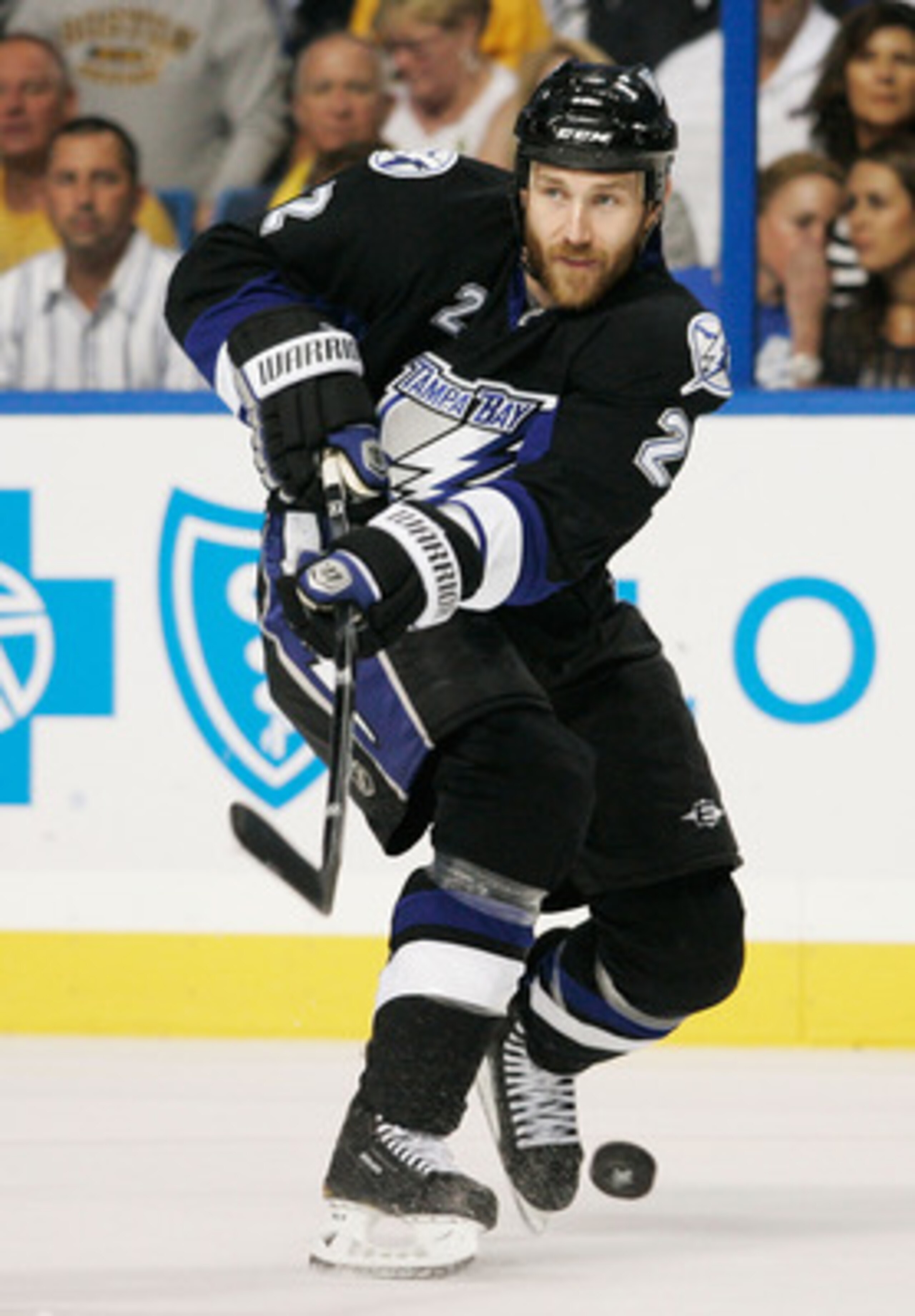 TAMPA, FL - MAY 21:  Eric Brewer #2 of the Tampa Bay Lightning controls the puck in Game Four of the Eastern Conference Finals against the Boston Bruins during the 2011 NHL Stanley Cup Playoffs at St Pete Times Forum on May 21, 2011 in Tampa, Florida.  (P