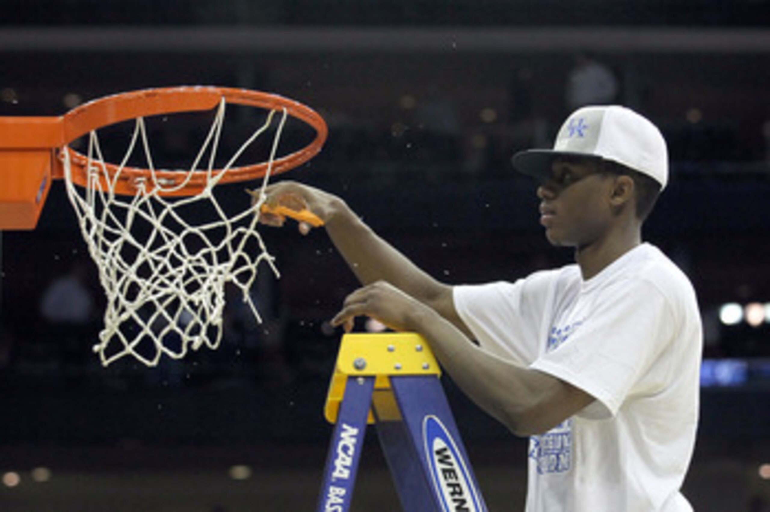NEWARK, NJ - MARCH 27:  MVP Brandon Knight #12 of the Kentucky Wildcats cuts the net after defeating the North Carolina Tar Heels in the east regional final of the 2011 NCAA men's basketball tournament at Prudential Center on March 27, 2011 in Newark, New