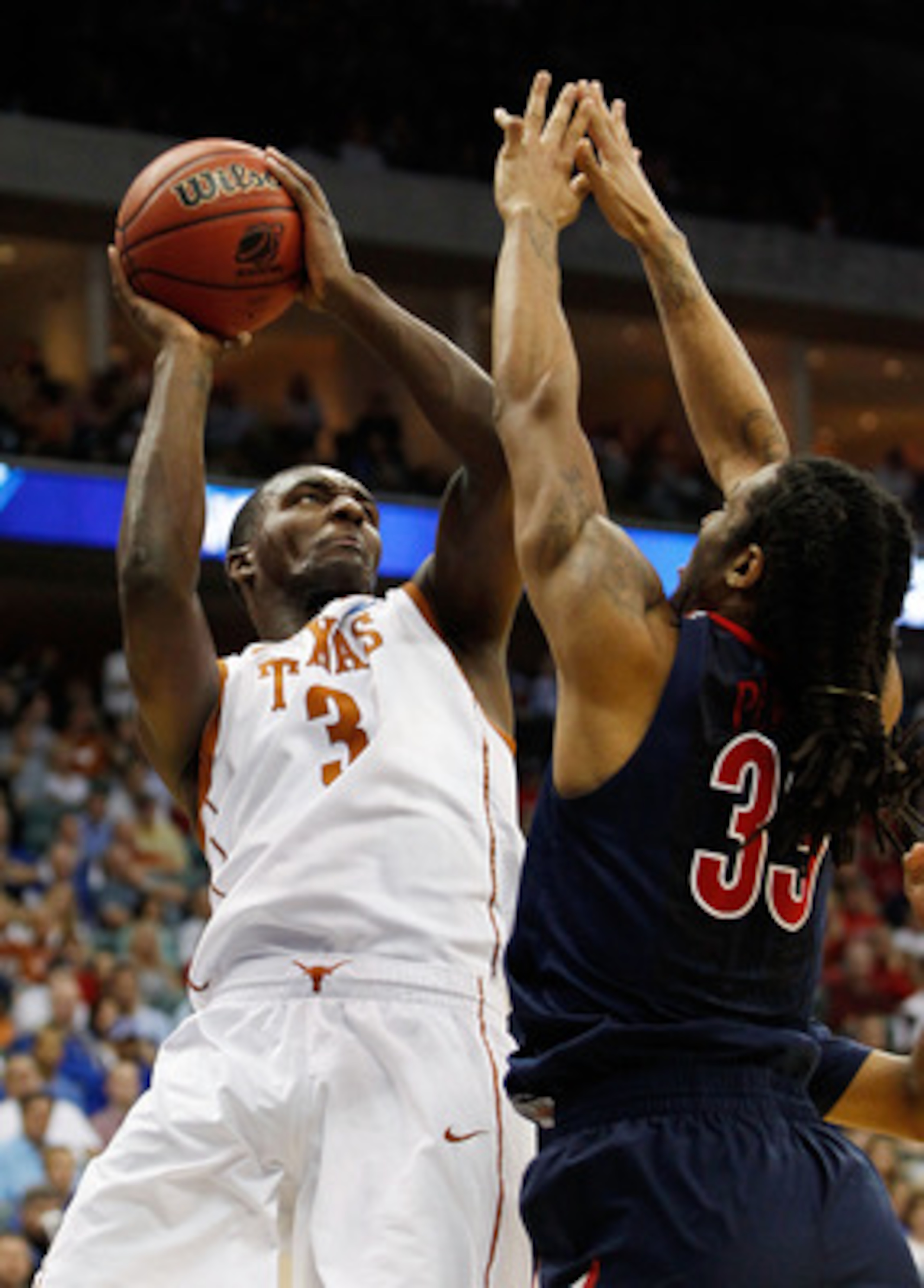 TULSA, OK - MARCH 20:  Jordan Hamilton #3 of the Texas Longhorns goes up for a shot against Jesse Perry #33 of the Arizona Wildcats during the third round of the 2011 NCAA men's basketball tournament at BOK Center on March 20, 2011 in Tulsa, Oklahoma.  (P