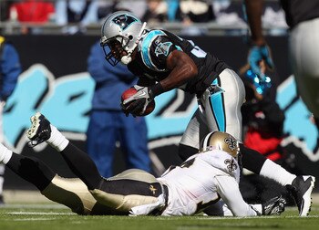 CHARLOTTE, NC - NOVEMBER 07:  Robert Meachem #17 of the New Orleans Saints tries to tackle Richard Marshall #31 of the Carolina Panthers after an interception during their game at Bank of America Stadium on November 7, 2010 in Charlotte, North Carolina.