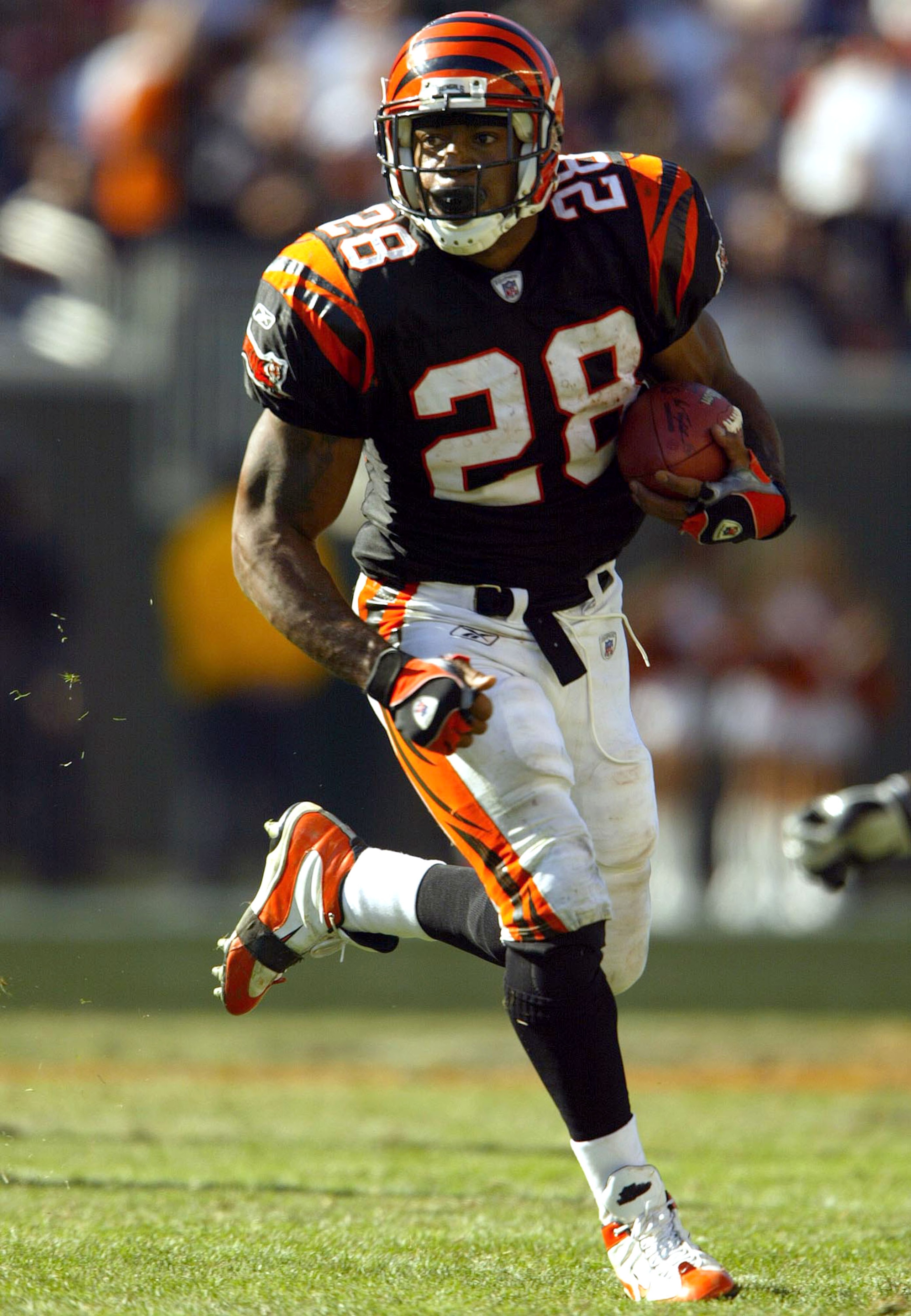 CINCINNATI, OH - OCTOBER 19:  Corey Dillon #28 of the Cincinnati Bengals runs with the ball against the Baltimore Ravens during the 34-26 Bengals win over the Ravens October 19, 2003 at Paul Brown Stadium in Cincinnati, Ohio.  (Photo by Andy Lyons/Getty I