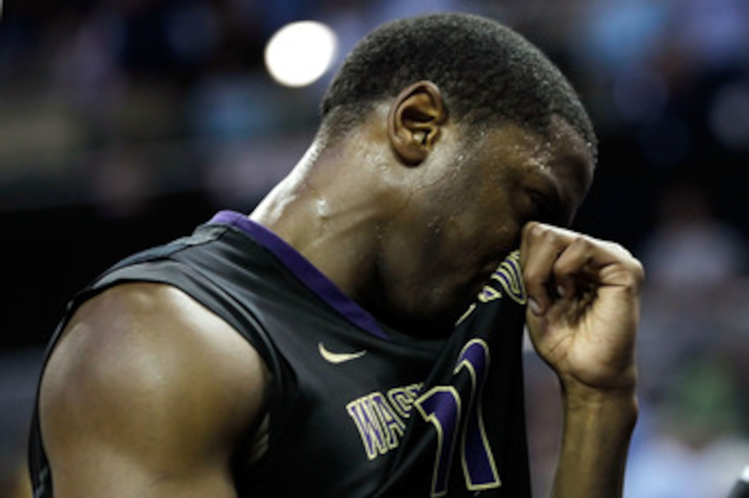 CHARLOTTE, NC - MARCH 20:  Matthew Bryan-Amaning #11 of the Washington Huskies reacts after the Huskies were defeated 86-83 by the North Carolina Tar Heels during the third round of the 2011 NCAA men's basketball tournament at Time Warner Cable Arena on M