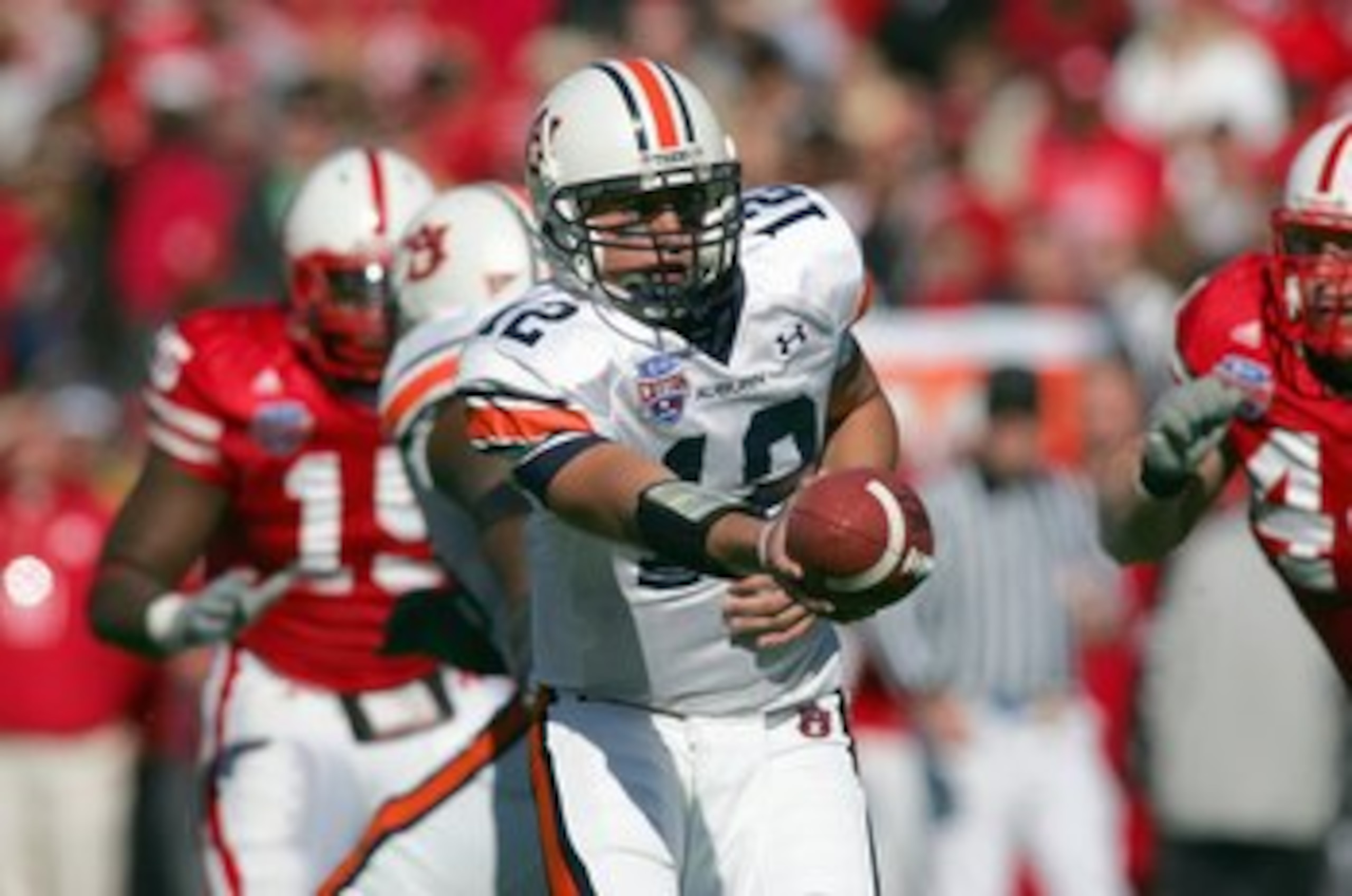 DALLAS - JANUARY 01: Quarterback Brandon Cox #12 of the Auburn Tigers hands off the ball during the AT&T Cotton Bowl Classic against the Nebraska Cornhuskers on January 1, 2007 at the Cotton Bowl in Dallas, TX. (Photo by Ronald Martinez/Getty Images)