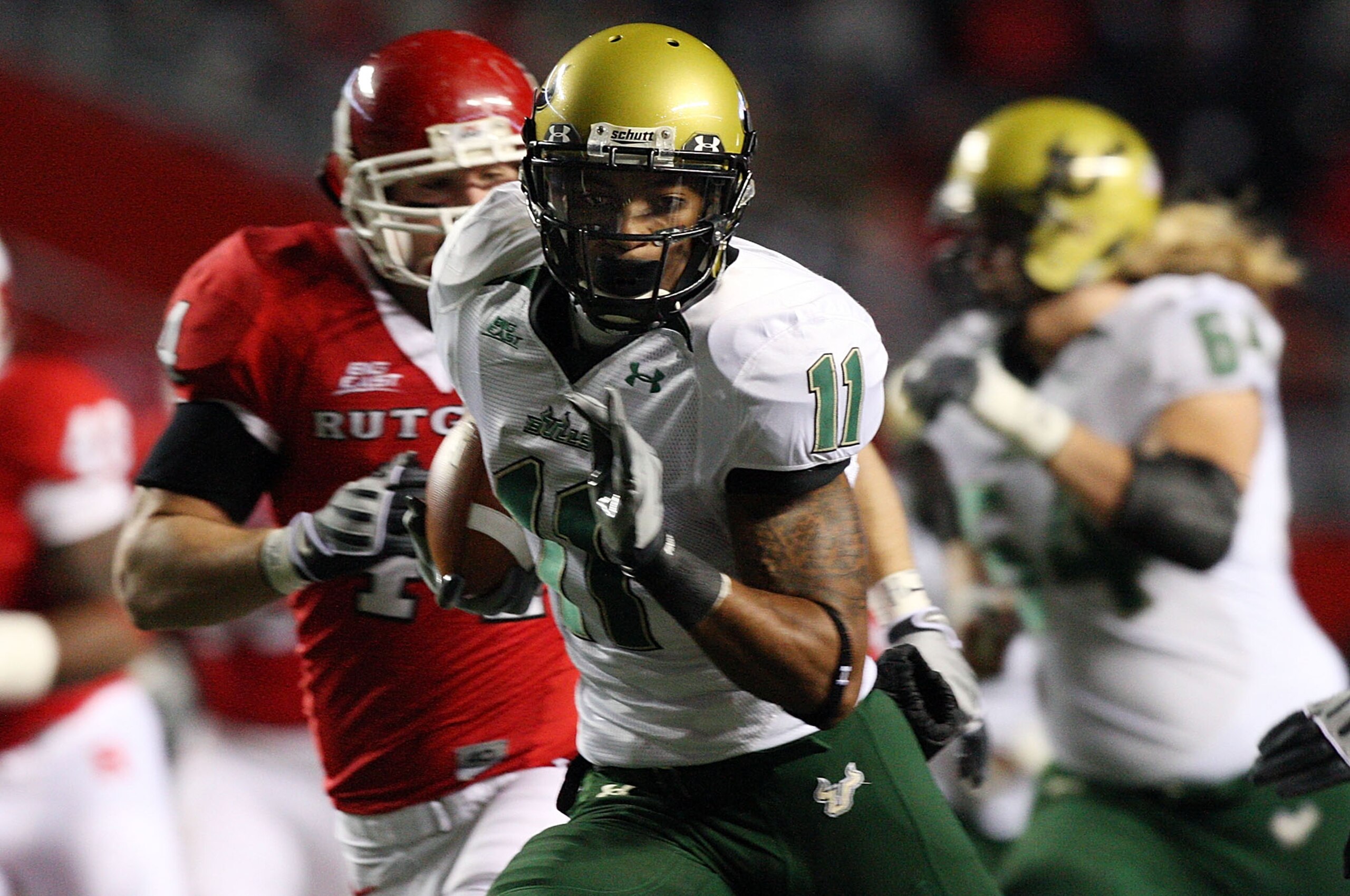 PISCATAWAY, NJ - NOVEMBER 12:  A.J. Love #11 of the South Florida Bulls runs the ball against the Rutgers Scarlet Knights at Rutgers Stadium on November 12, 2009 in Piscataway, New Jersey.  (Photo by Jim McIsaac/Getty Images)