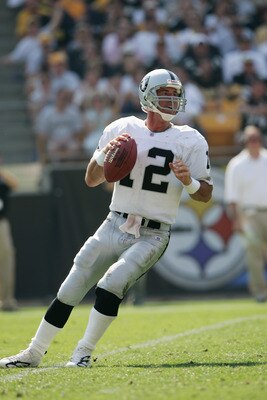 PITTSBURGH - SEPTEMBER 12:  Quarterback Rich Gannon #12 of the Oakland Raiders drops back to pass against the Pittsburgh Steelers during the game at Heinz Field on September 12, 2004 in Pittsburgh, Pennsylvania. The Steelers defeated the Raiders 24-21. (P
