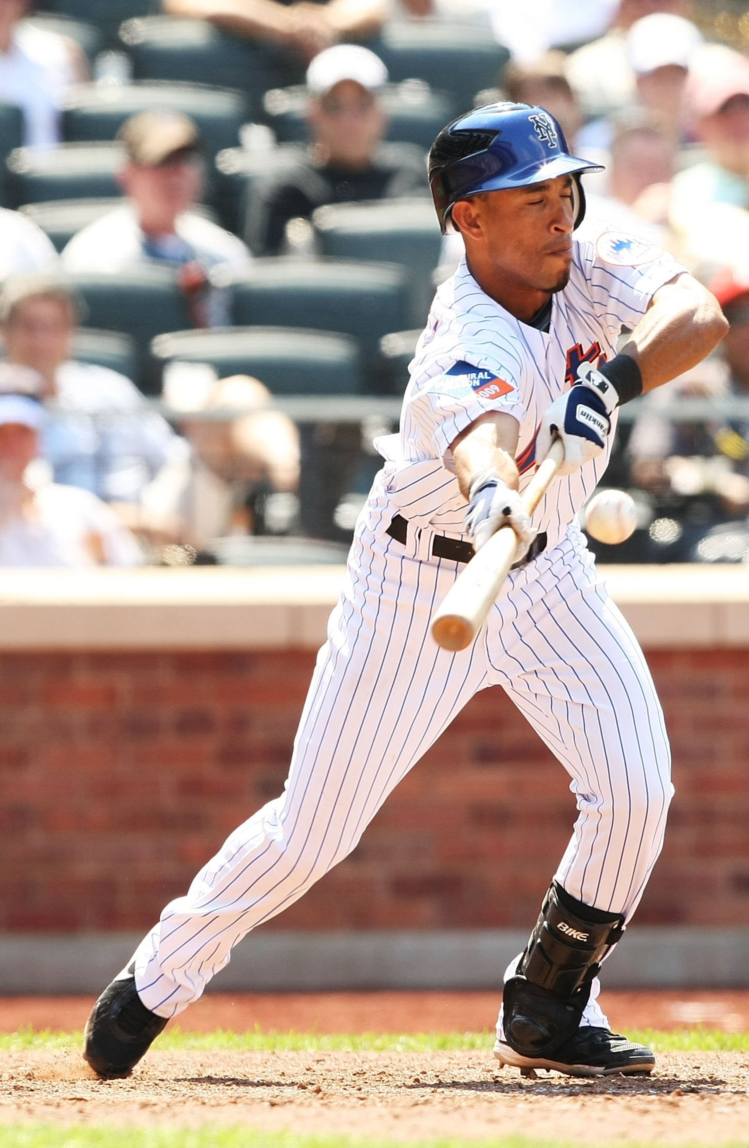 NEW YORK - MAY 31:  Wilson Valdez #4 of the New York Mets bunts against the Florida Marlins during their game on May 31, 2009 at Citi Field in the Flushing neighborhood of the Queens borough of New York City.  (Photo by Al Bello/Getty Images)