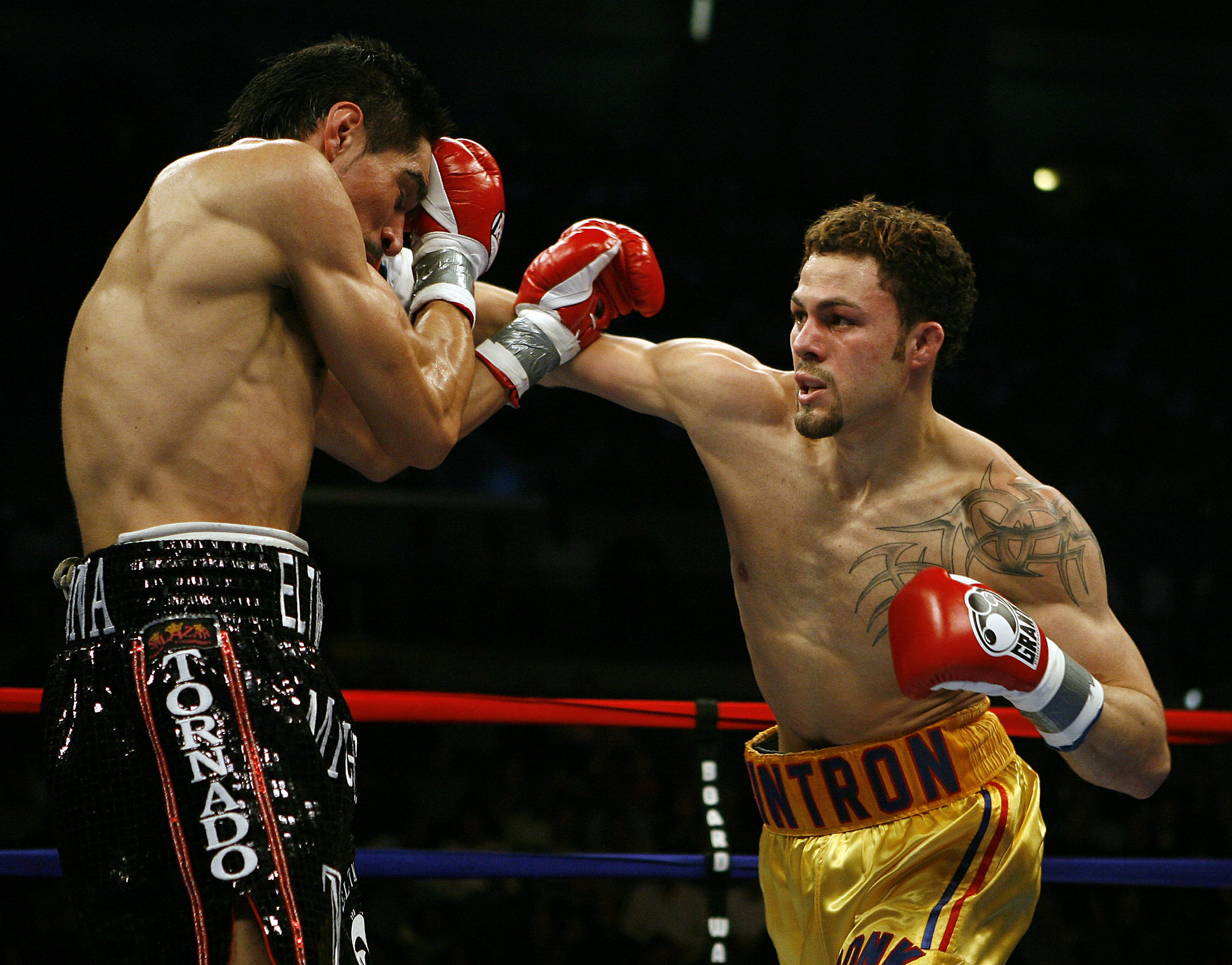 ATLANTIC CITY, NJ  - APRIL 12: Kermit Cintron (R) throws a punch during his IBF World Welterweight Title bout against Antonio Margarito at Boardwalk Hall on April 12, 2008 in Atlantic City, New Jersey. (Photo by Jeff Zelevansky/Getty Images)