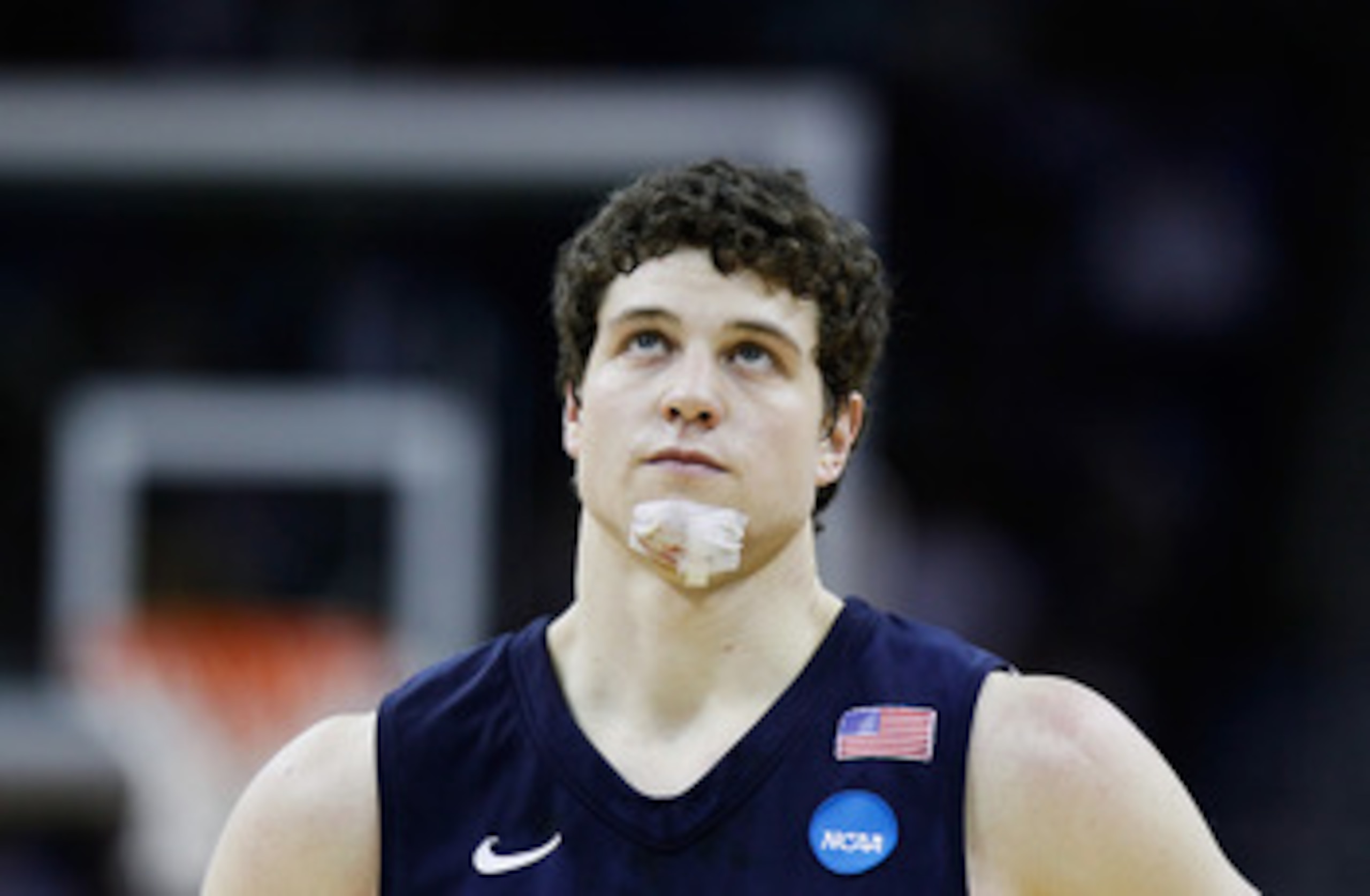 NEW ORLEANS, LA - MARCH 24:  Jimmer Fredette #32 of the Brigham Young Cougars looks on with a bandage on his chin during the second half against the Florida Gators during the Southeast regional of the 2011 NCAA men's basketball tournament at New Orleans A