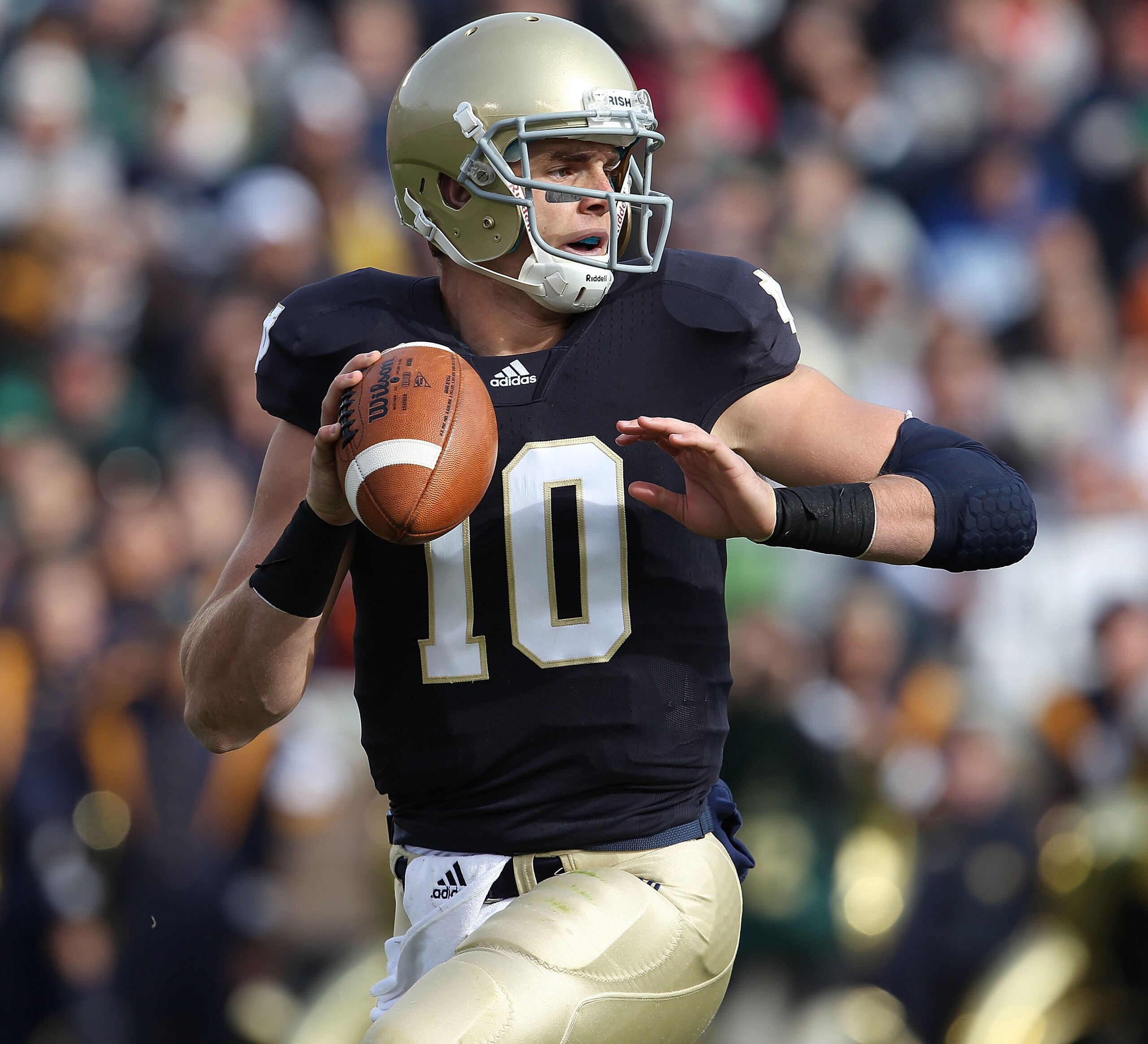 SOUTH BEND, IN - OCTOBER 30: Dayne Crist #10 of the Notre Dame Fighting Irish looks for a receiver against the Tulsa Golden Hurricane at Notre Dame Stadium on October 30, 2010 in South Bend, Indiana. Tulsa defeated Notre Dame 28-27. (Photo by Jonathan Dan