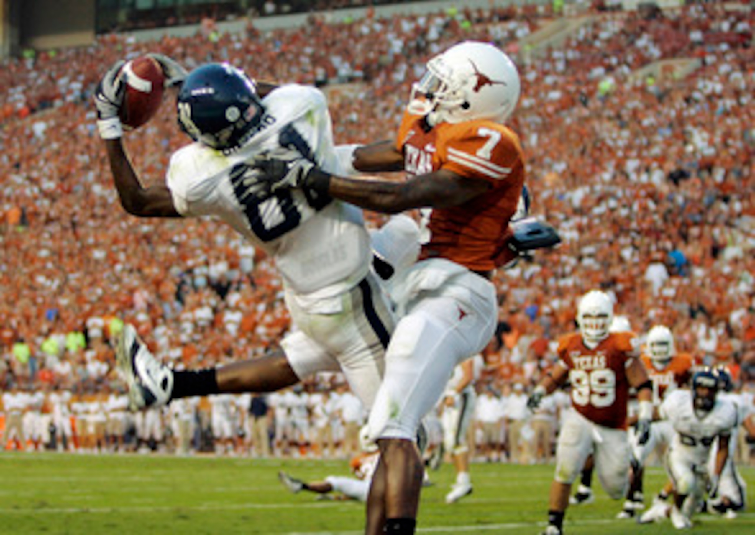 AUSTIN, TX - SEPTEMBER 20:  Cornerback Deon Beasley #7 of the Texas Longhorns gets called for pass interference as wide receiver Jarett Dillard #81 of the Rice Owls drops a pass in the endzone in the second quarter on September 20, 2008 at Darrell K Royal