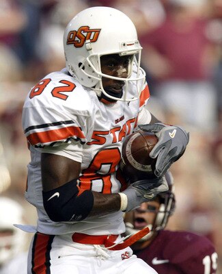 COLLEGE STATION, TX - OCTOBER 25:  Wide receiver Rashaun Woods #82 of the Oklahoma State Cowboys makes a pass reception against the Texas A&M Aggies October 25, 2003 at Kyle Field in College Station, Texas.  The Cowboys defeated the Aggies 38-10.  (Photo